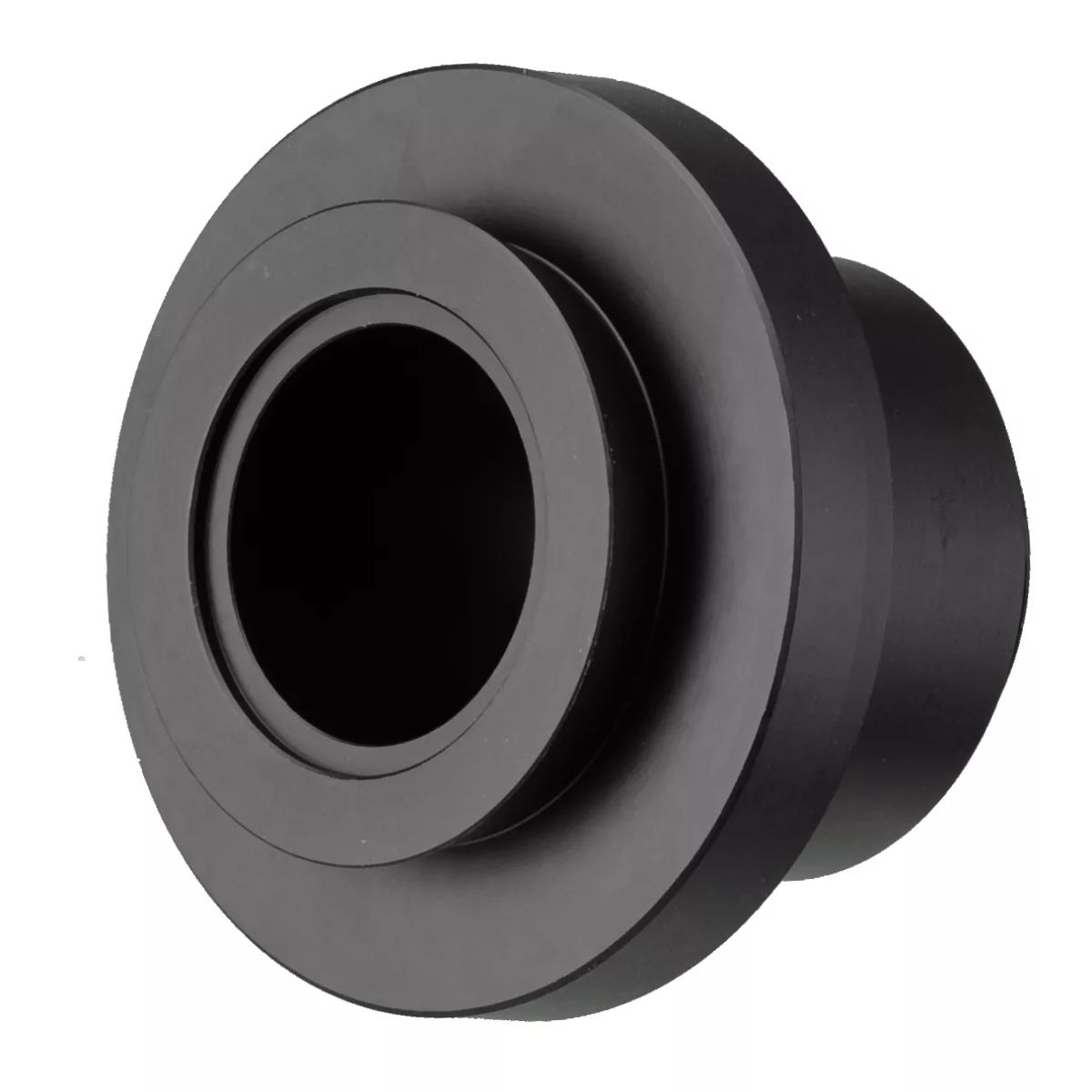 Se muestra un objeto circular negro con un agujero en el medio, aislado sobre un fondo blanco.