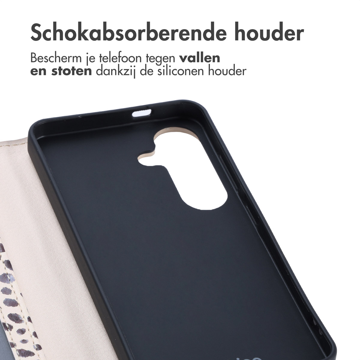 Intérieur d'un étui de téléphone noir avec une découpe pour le téléphone, sur fond clair.