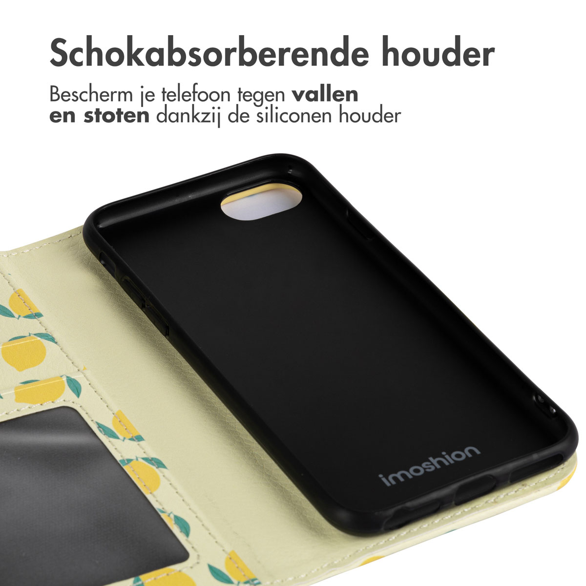 Close-up van een telefoonhoesje met een zwart interieur en een geel citroenpatroon aan de buitenkant.