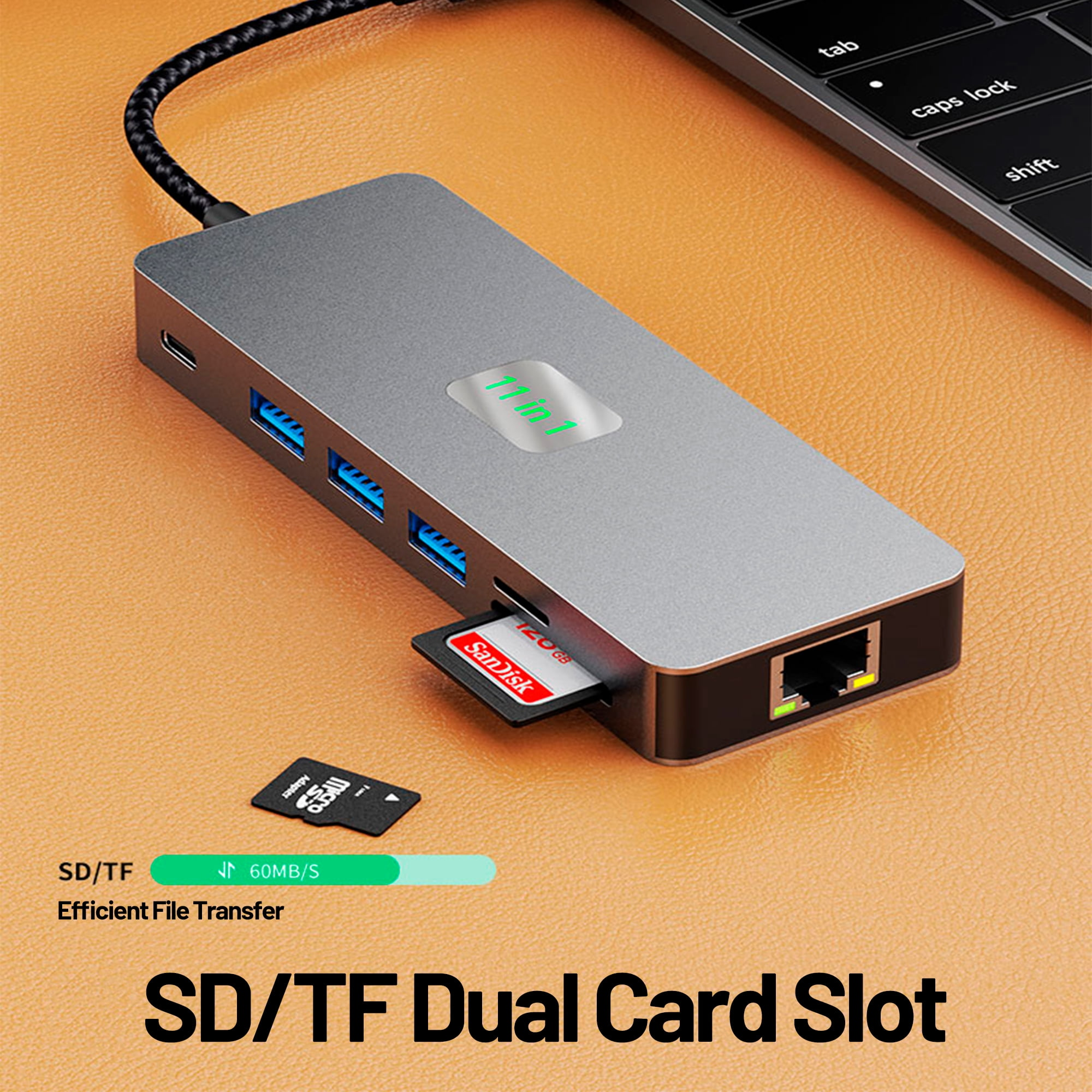 Ein grauer USB-Hub mit mehreren Anschlüssen. Enthält einen SD/TF-Kartensteckplatz und ein Kabel, das an einen Laptop angeschlossen ist.