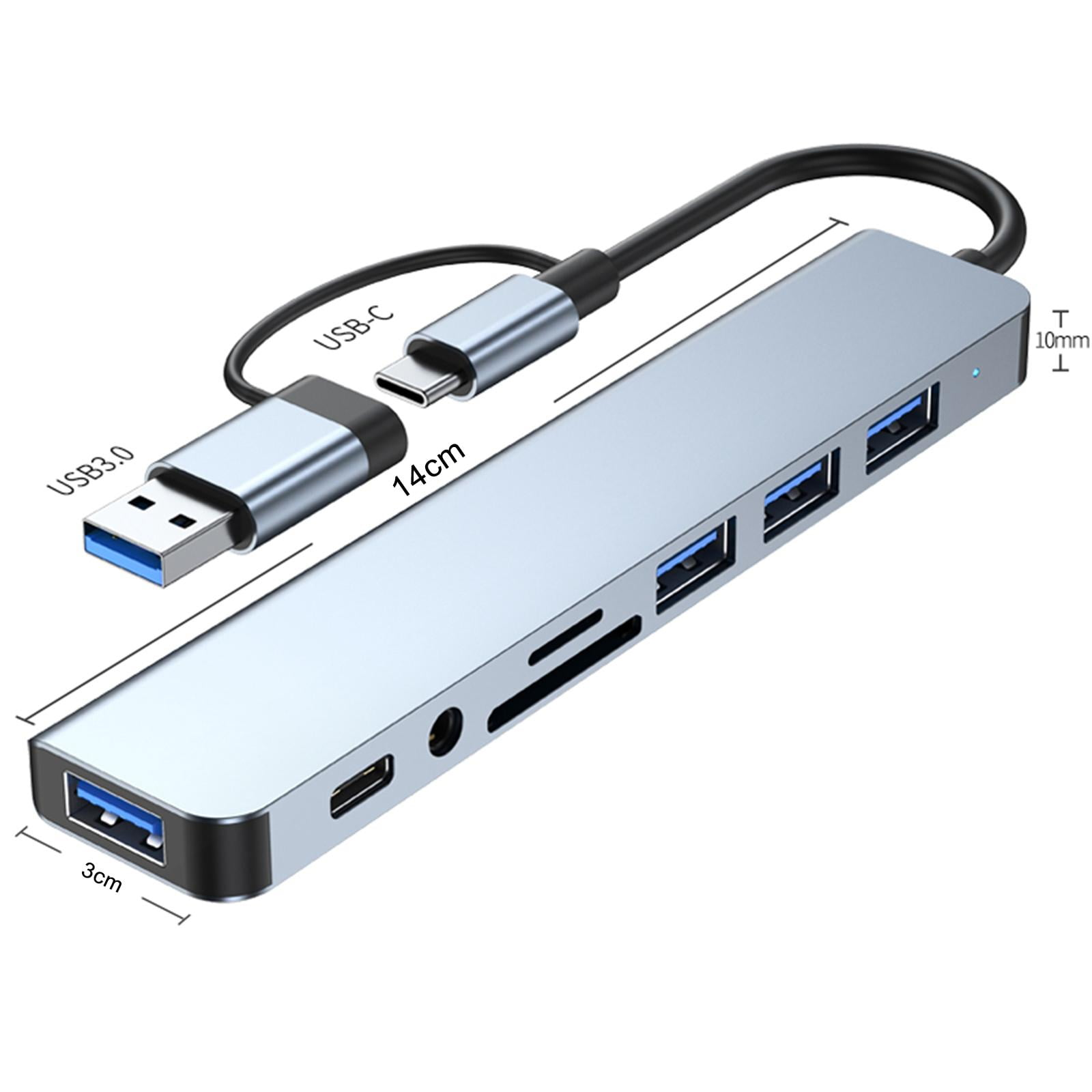 Ein silberner USB-Hub mit mehreren Anschlüssen und Steckern, vor weißem Hintergrund.