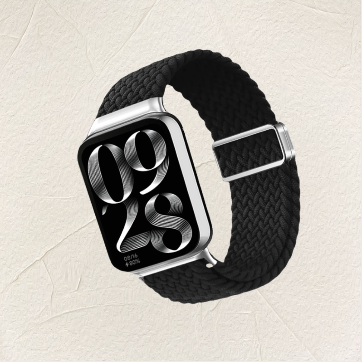 Uno smartwatch con un cinturino nero intrecciato, che mostra la data e l'ora.