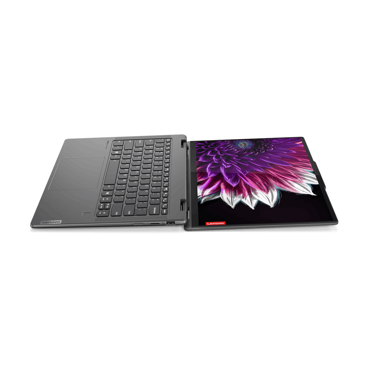 Portátil abierto, mostrando teclado y pantalla colorida. Marca Lenovo.
