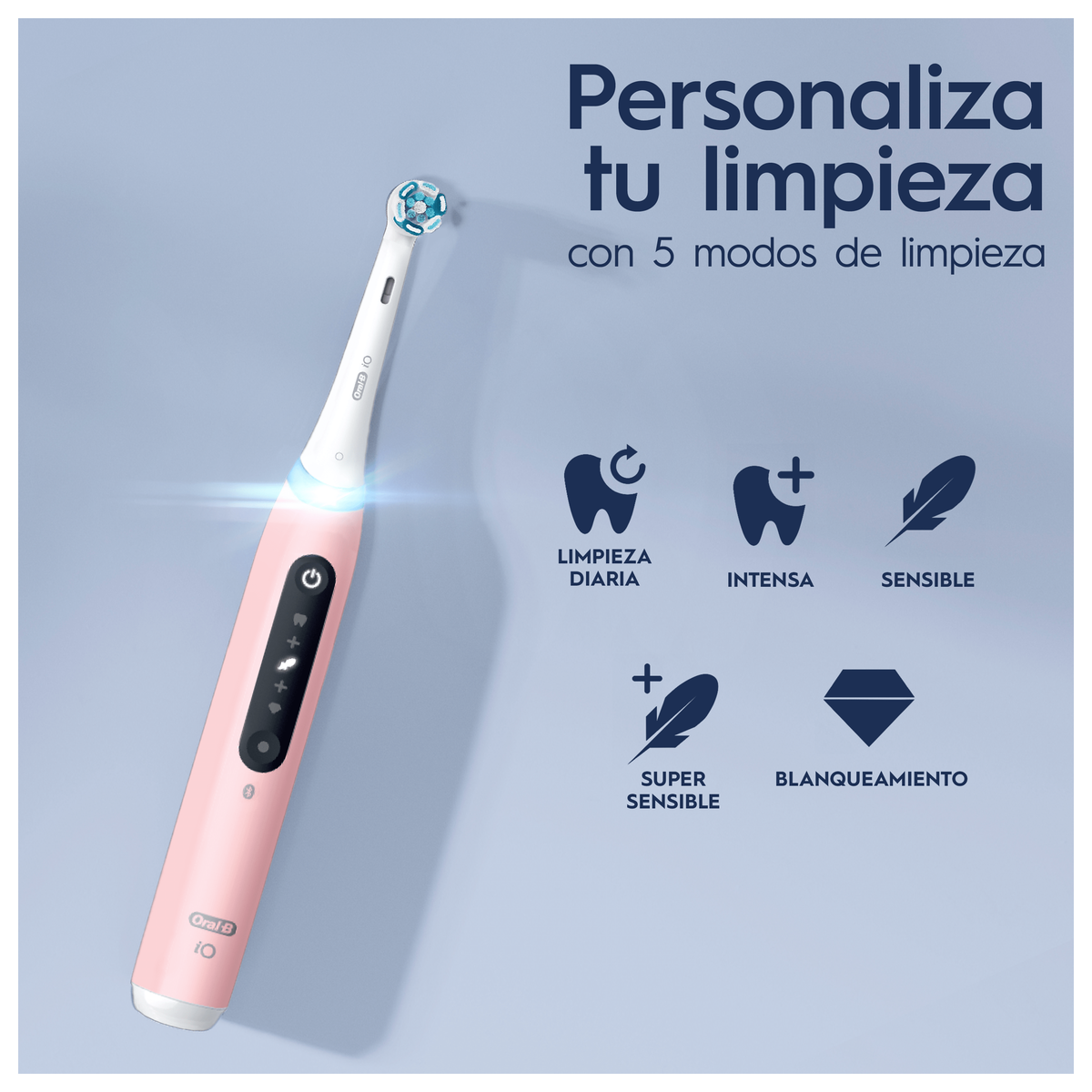 Spazzolino elettrico rosa con icone per diverse modalità di pulizia su sfondo rosa chiaro.