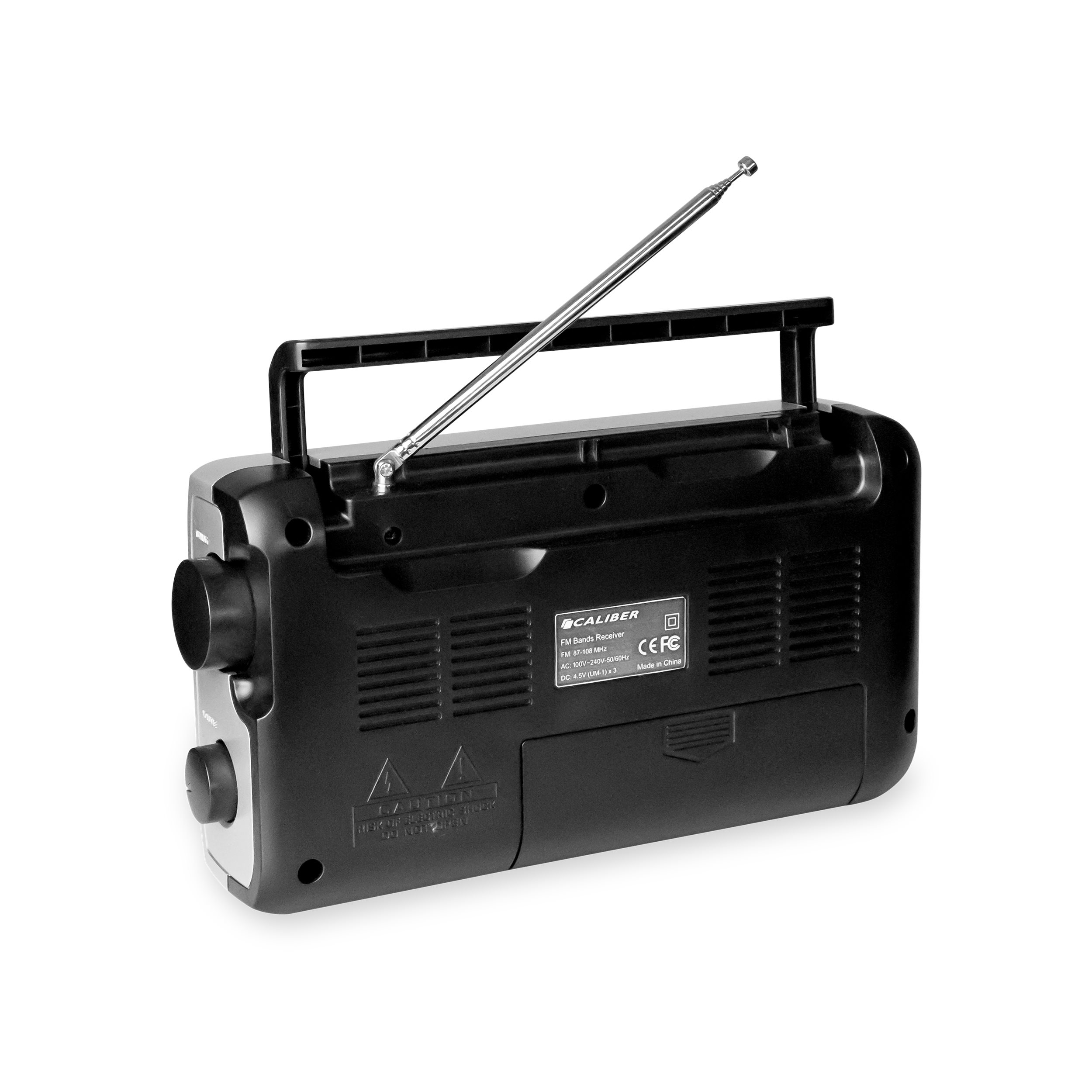 Black and silver portable radio with antenna extended, handle up, and control knobs. Isolated on white.