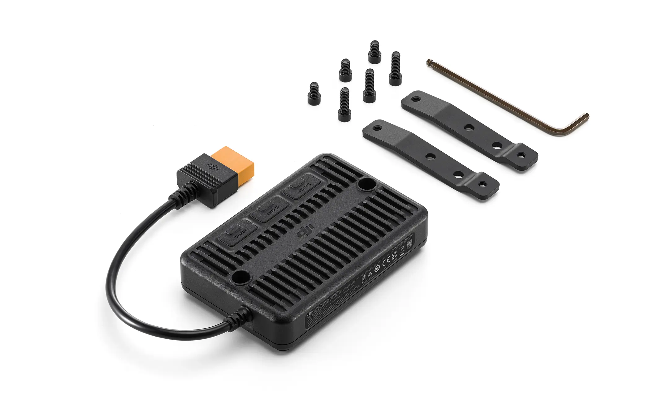 Ein schwarzes elektronisches Gerät mit Kabel, Schrauben und Halterungen auf weißem Hintergrund.