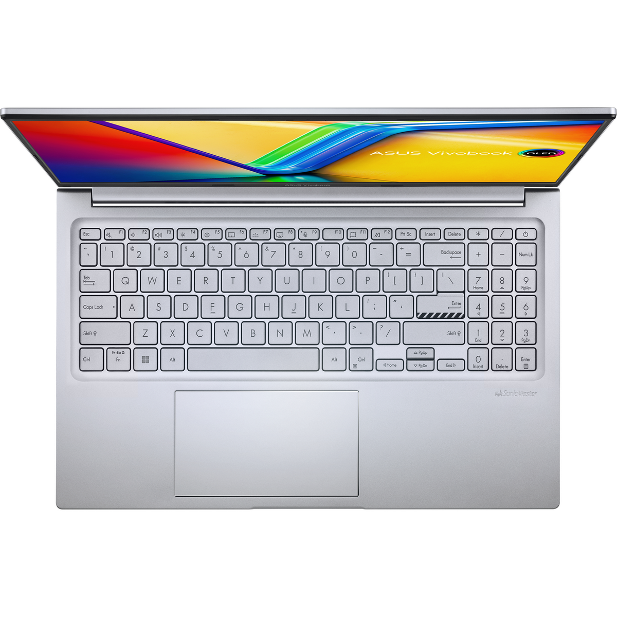 Portátil, vista superior, abierto. Cuerpo blanco, teclado plateado, pantalla colorida.