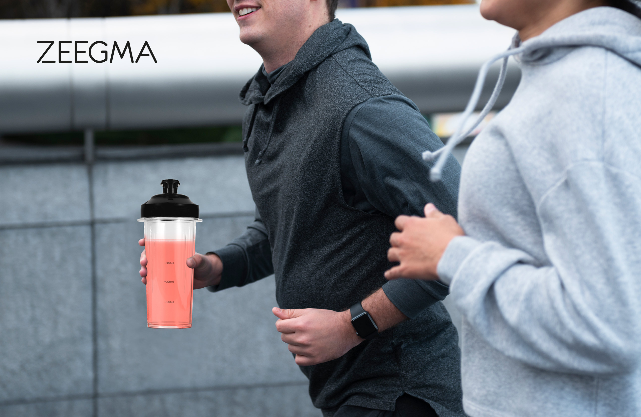 Two people running. A blender bottle is visible.