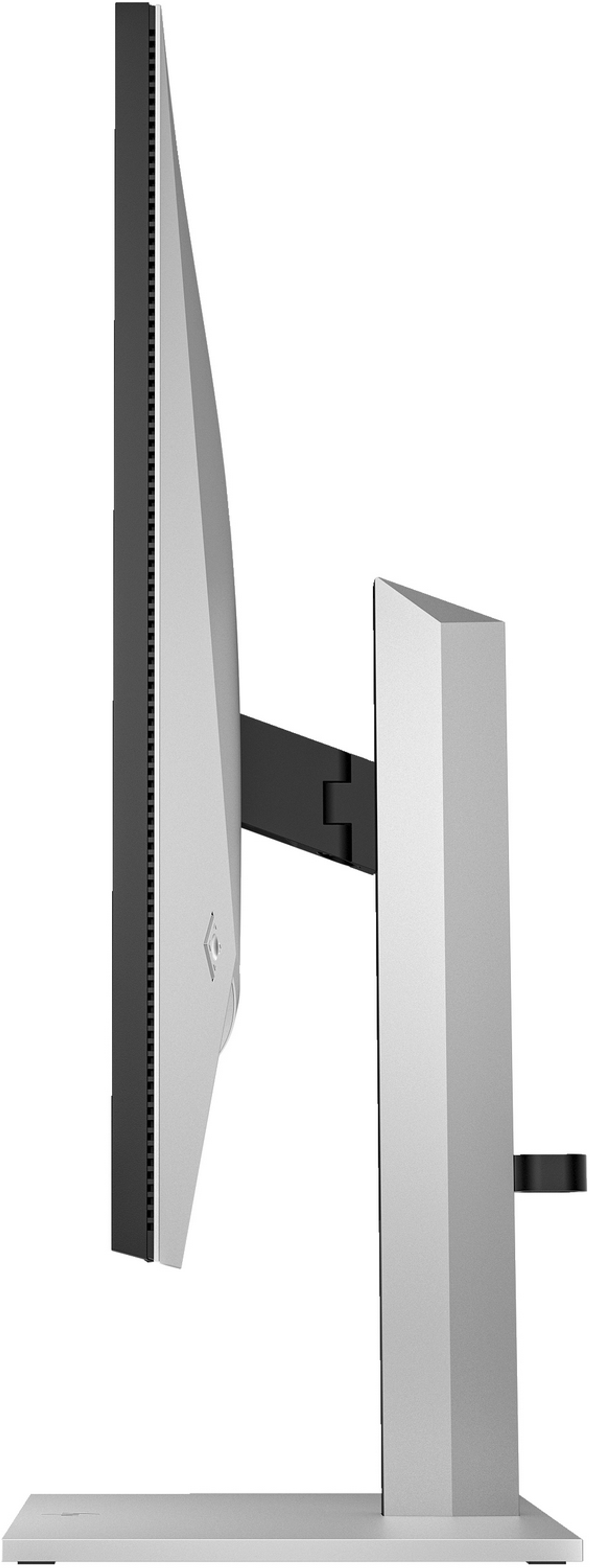 Widok z boku srebrno-czarnego monitora komputera na białym stojaku. Ekran jest wyłączony.