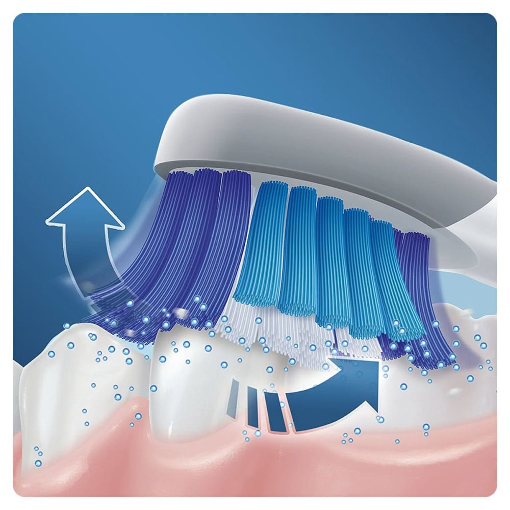 Zbliżenie włosia szczoteczki do zębów czyszczącego ząb. Pęcherzyki i niebieskie strumienie wskazują działanie.