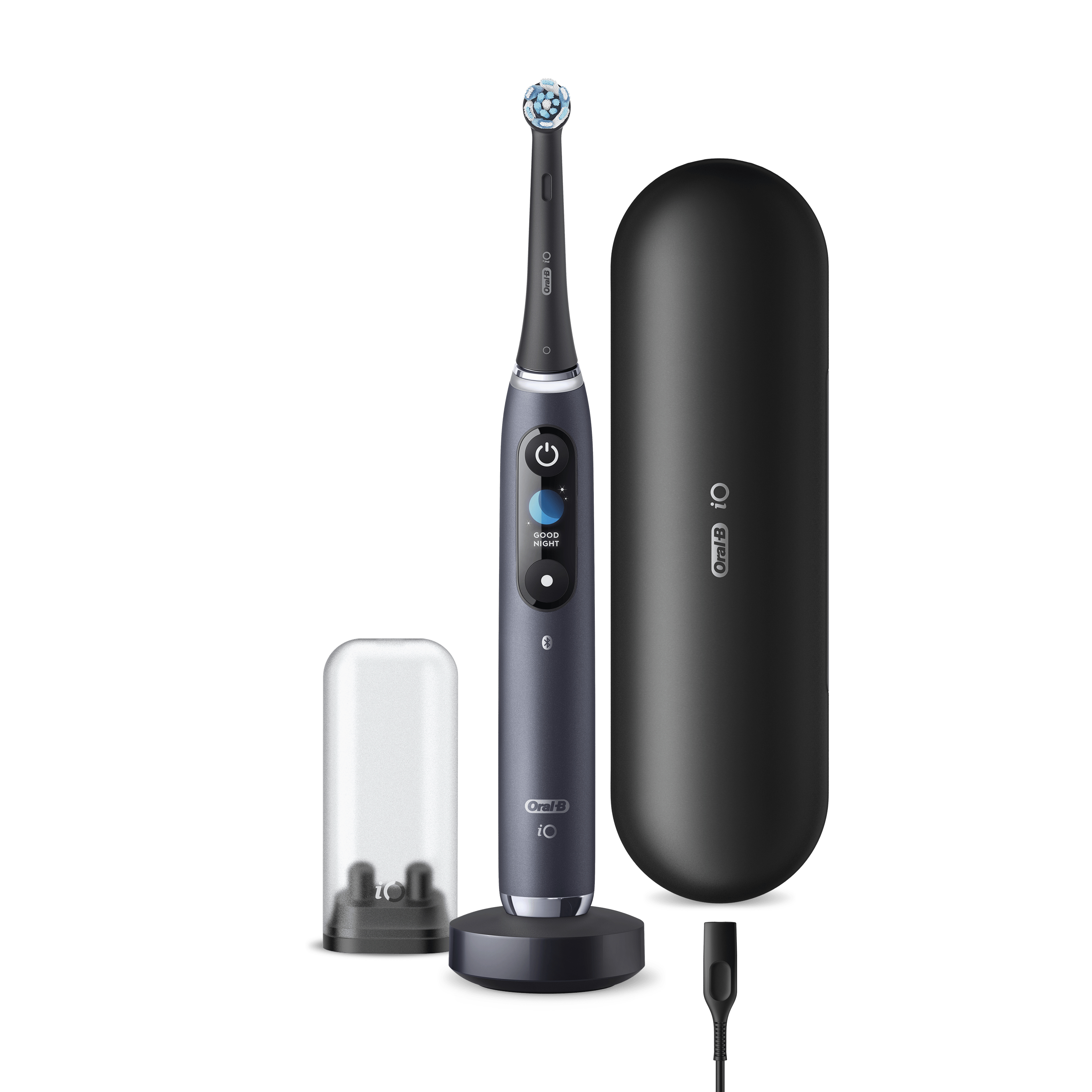 Un cepillo de dientes eléctrico Oral-B iO Series gris oscuro con accesorios.