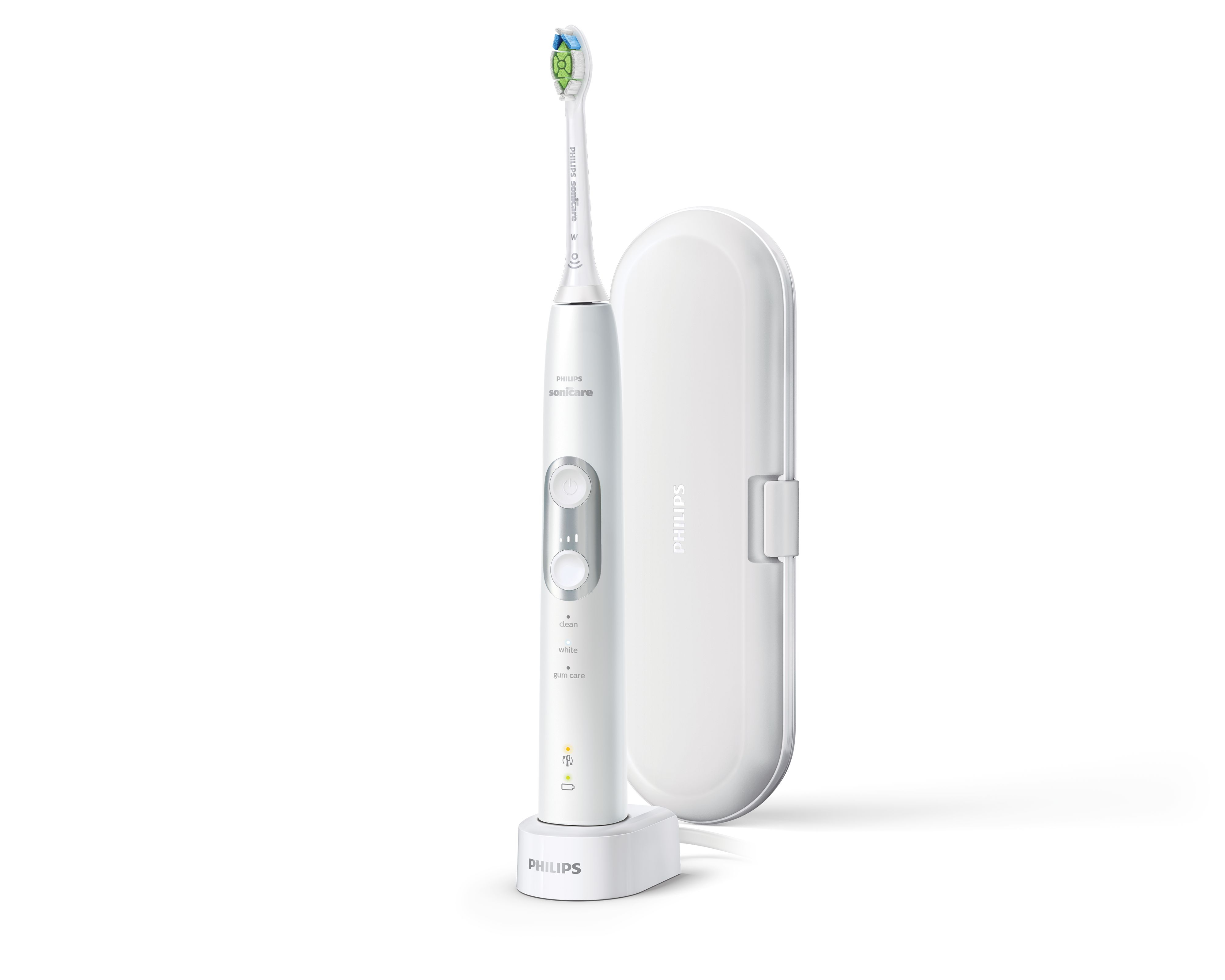 Spazzolino Philips Sonicare bianco su base di ricarica, vicino a custodia da viaggio bianca.