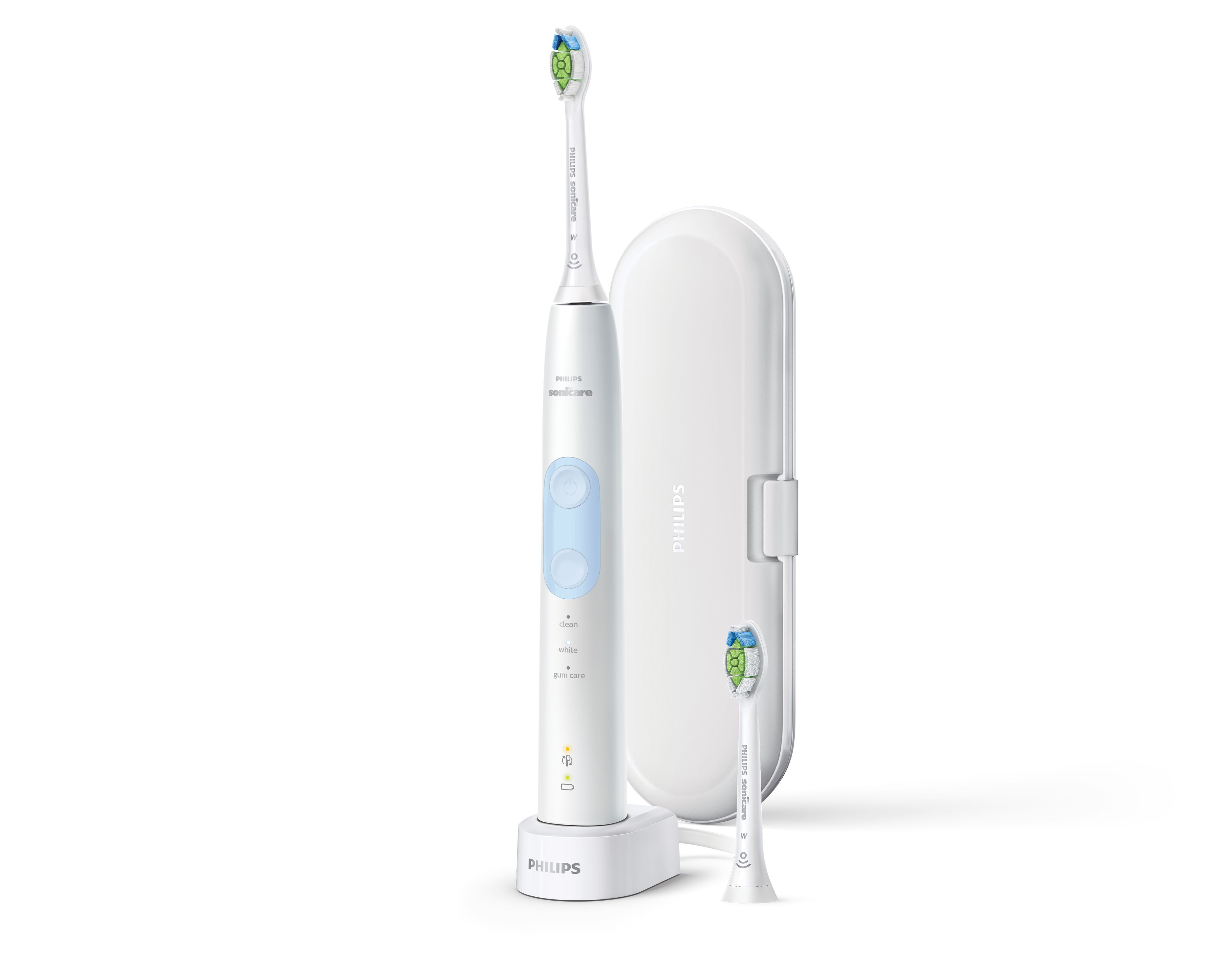 Cepillo dental eléctrico blanco, base de carga y un cabezal de repuesto sobre fondo blanco.