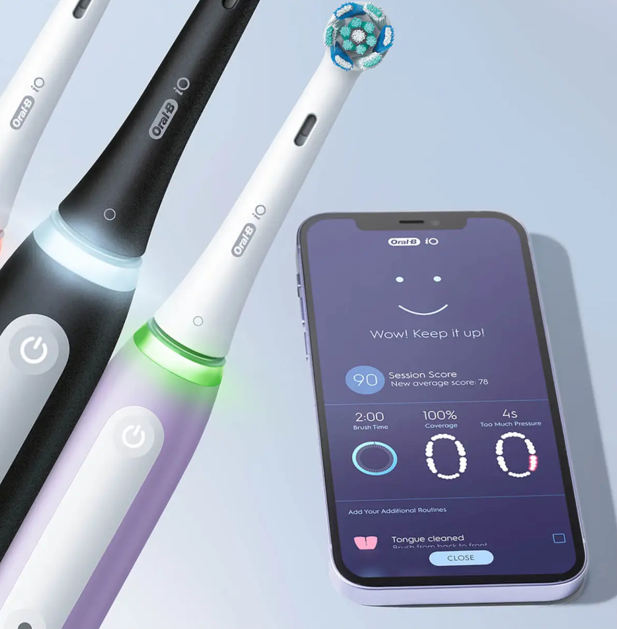 Trzy elektryczne szczoteczki do zębów ze smartfonem pokazującym dane szczotkowania, z logo Oral-B.