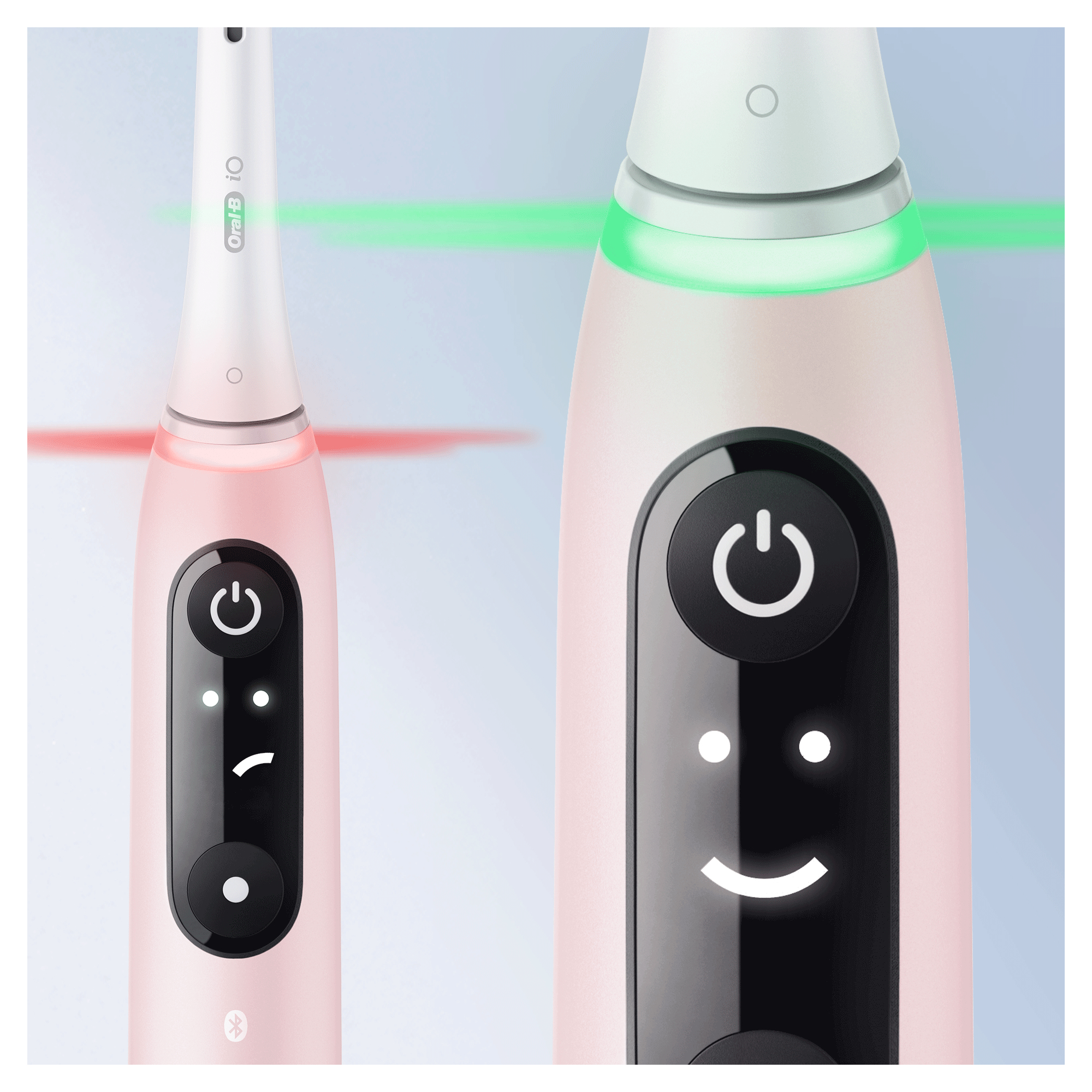 Twee roze en witte elektrische tandenborstels met verschillende lichtdisplays.