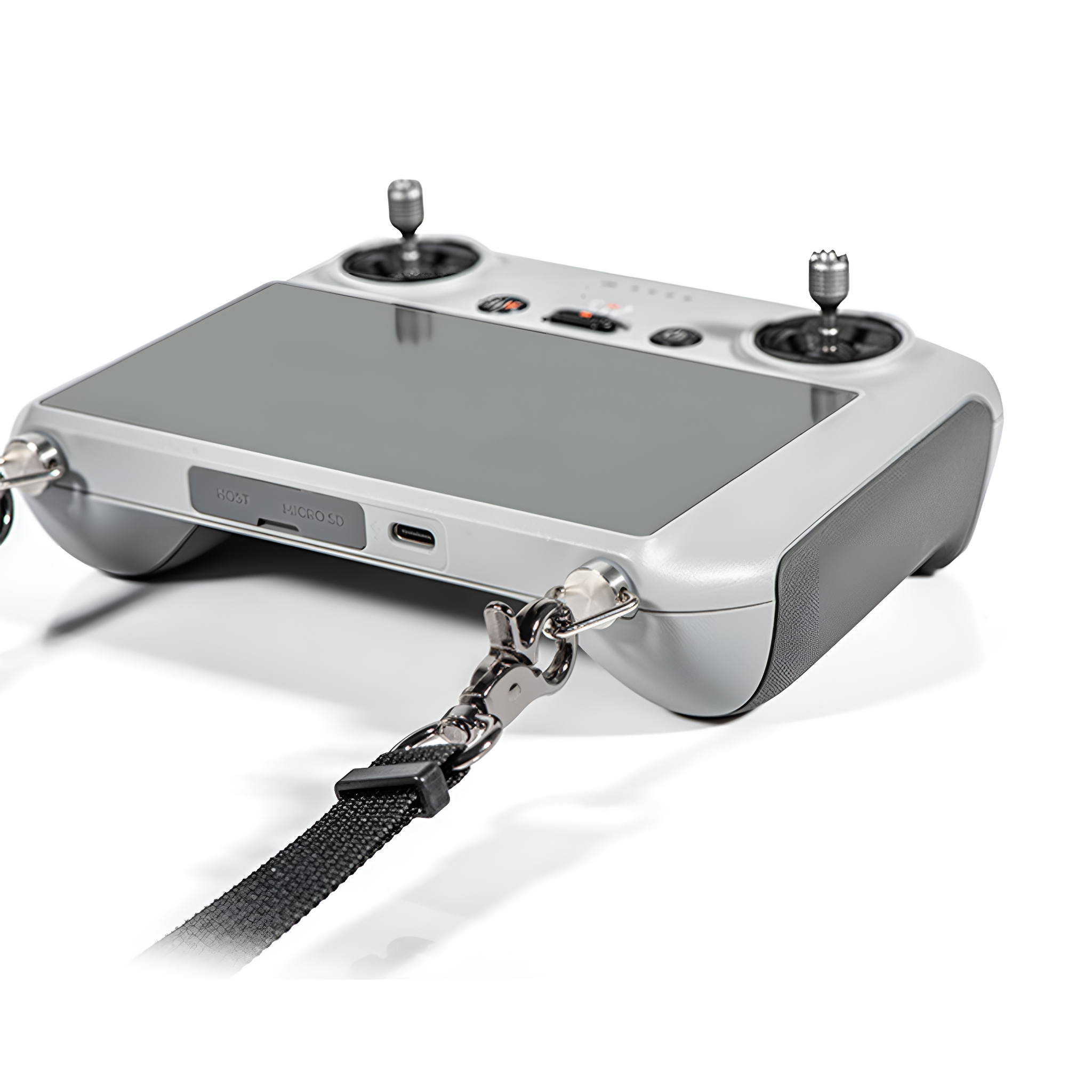 Graue Fernbedienung mit zwei Joysticks und Lanyard-Befestigung. MicroSD- und USB-Anschlüsse sichtbar.