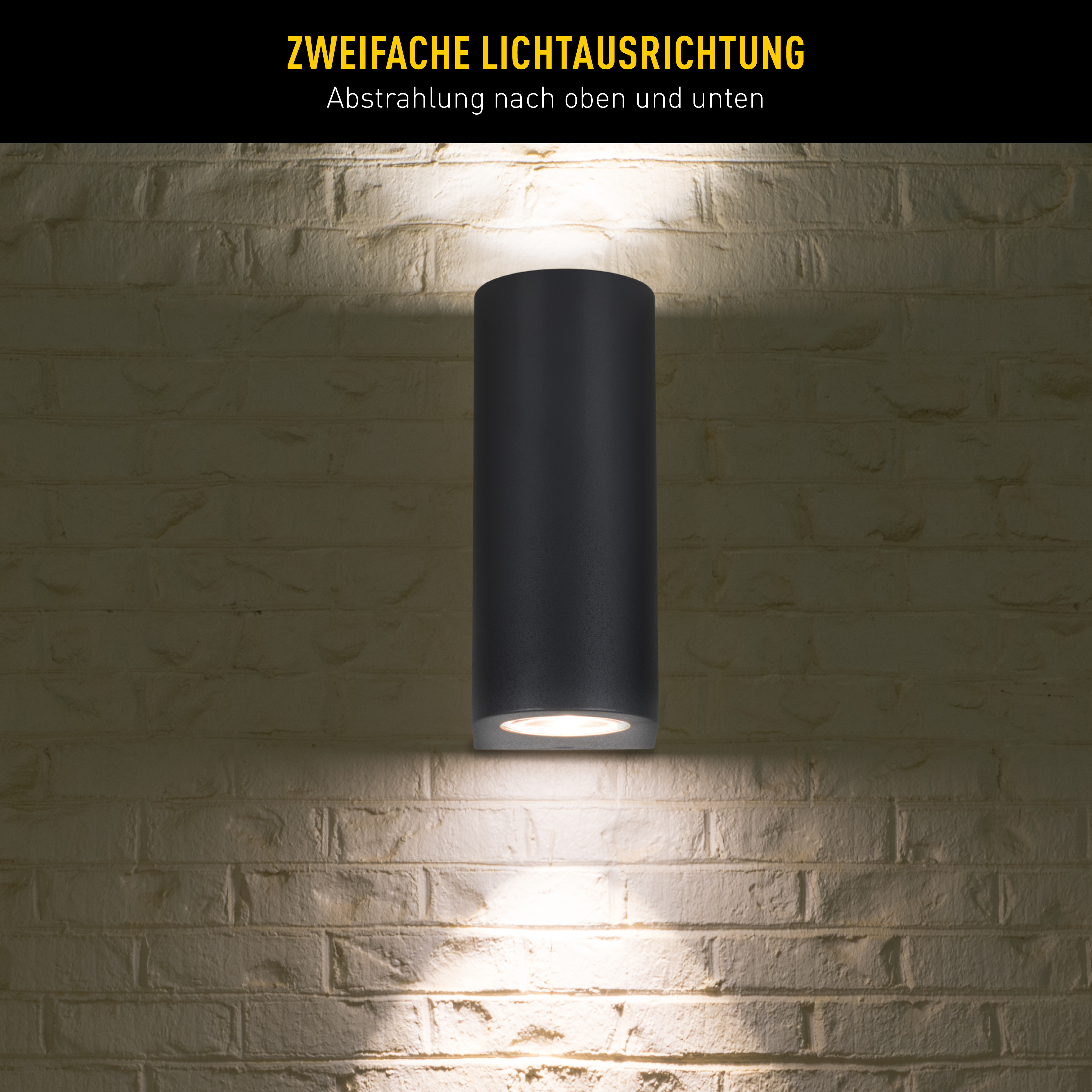 Schwarze zylindrische Außenleuchte an einer Backsteinmauer. Text: 'Doppelte Lichtausrichtung'.