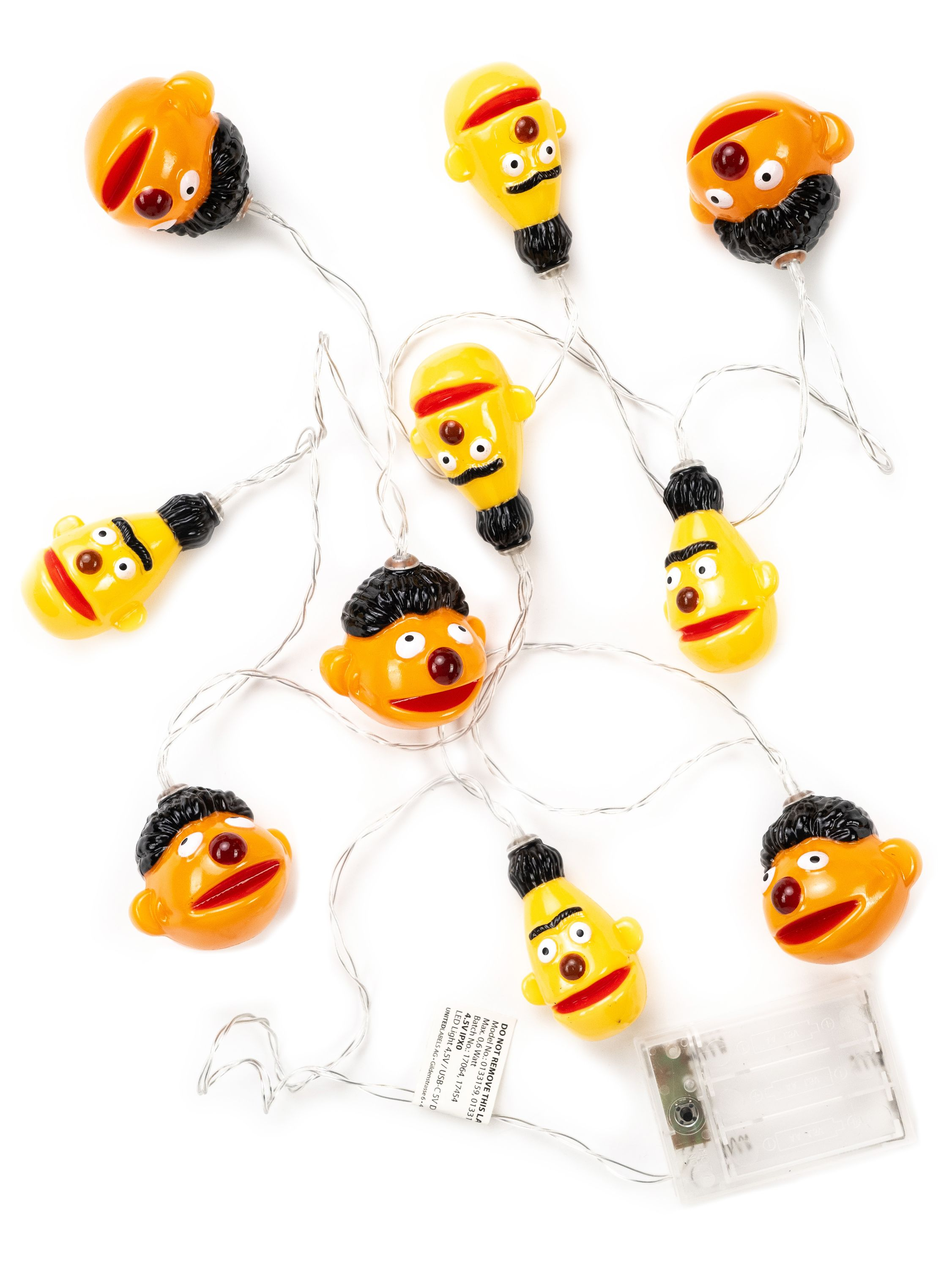 Lichterkette mit Ernie-Gesichtern, gelb und orange mit schwarzen Haaren und Augen.