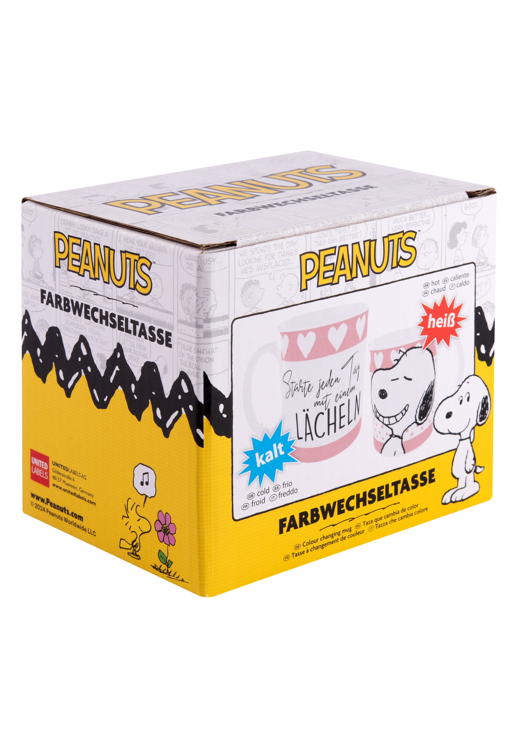 Ein Snoopy-Becher in einer Schachtel mit Text in mehreren Sprachen auf weißem Grund.