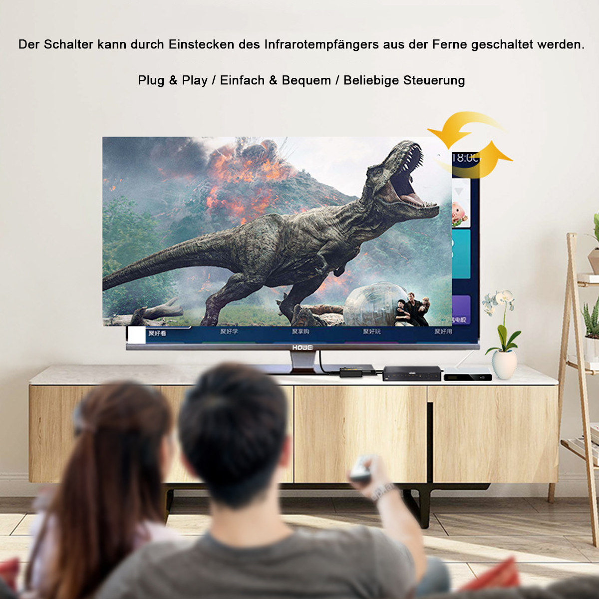 Menschen schauen einen Fernseher mit einem Dinosaurier.