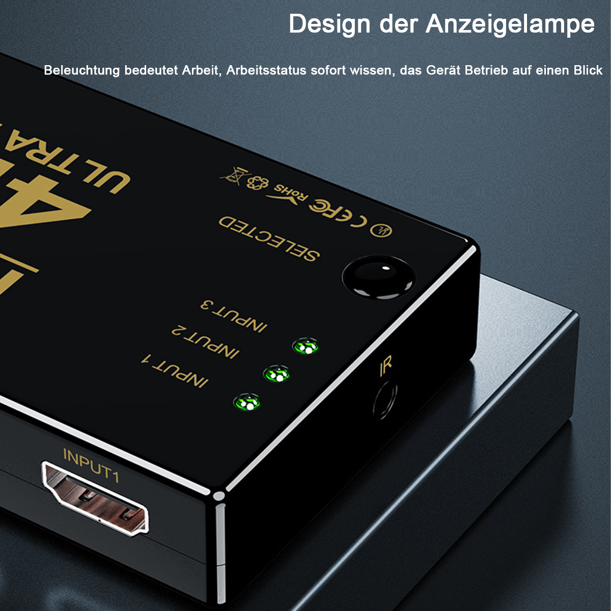 Schwarzes elektronisches Gerät mit grünen Lichtern. Text: Design der Anzeigelampe. Eingang 1, 2 und 3.