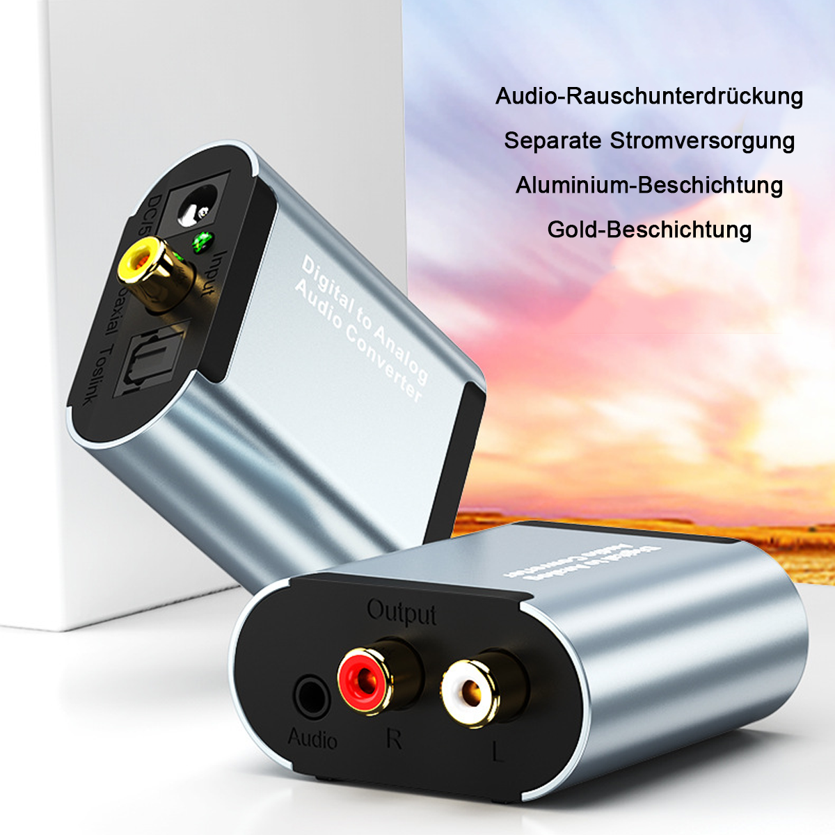 Silberner Digital-Analog-Audio-Konverter mit mehreren Ein- und Ausgangsanschlüssen, beschriftet.