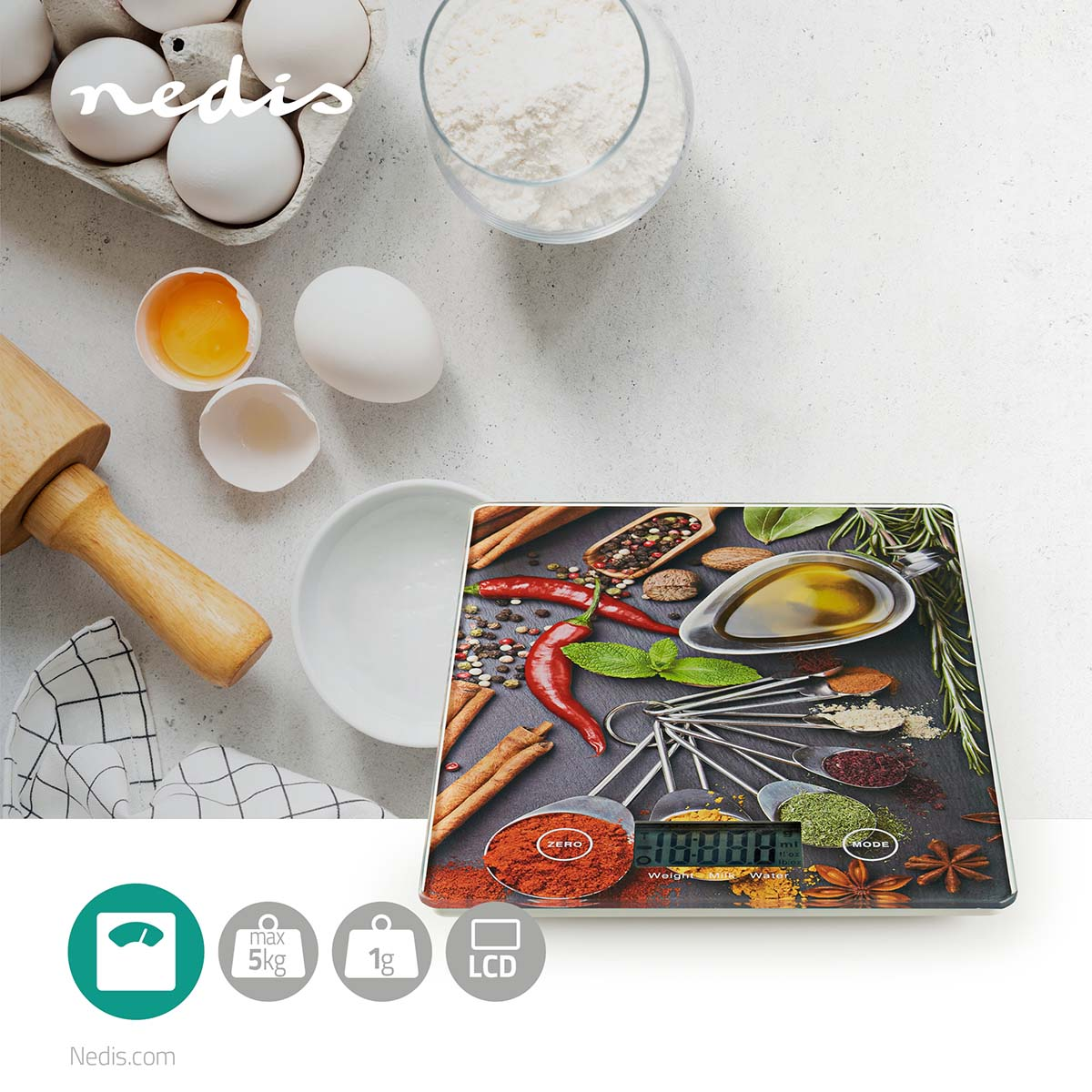 A digital kitchen scale with spices, a rolling pin, eggs, and flour.