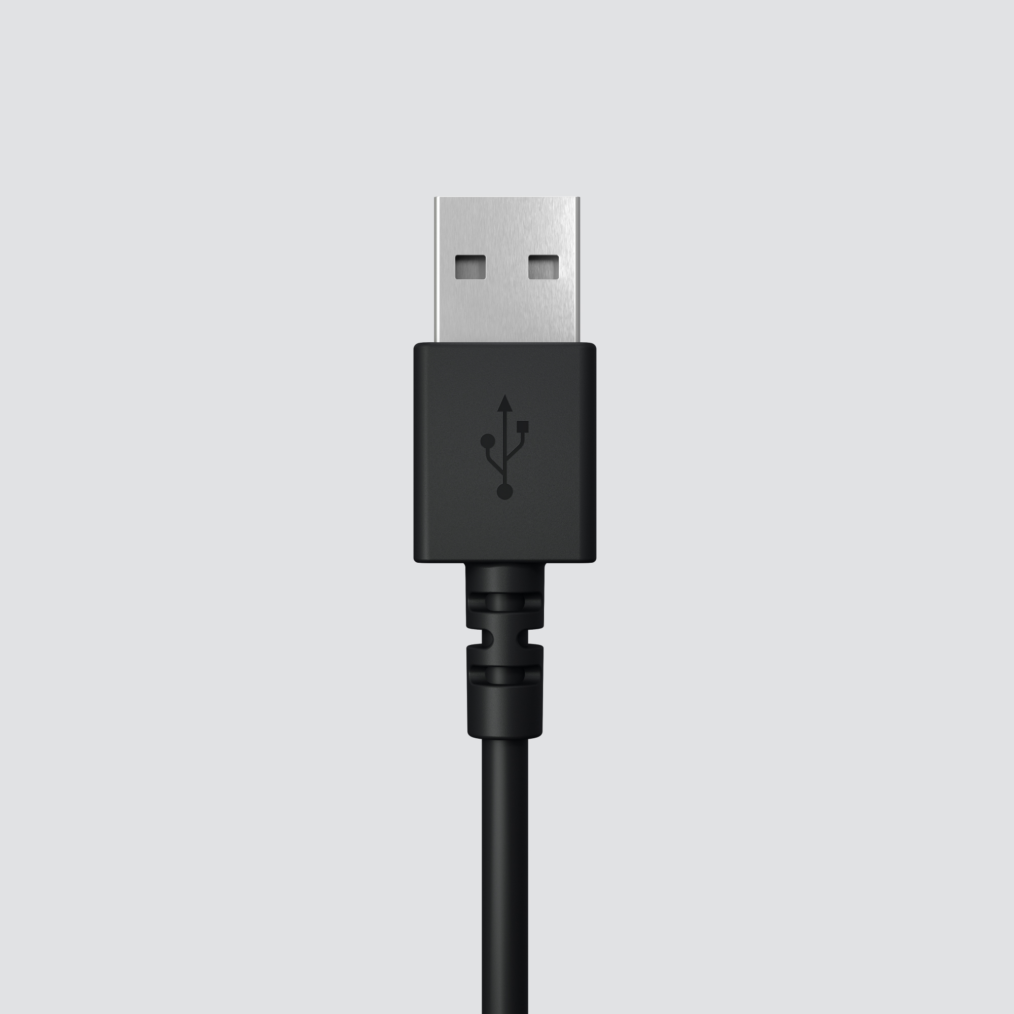 Un connettore USB nero con un simbolo USB, isolato su sfondo grigio chiaro.