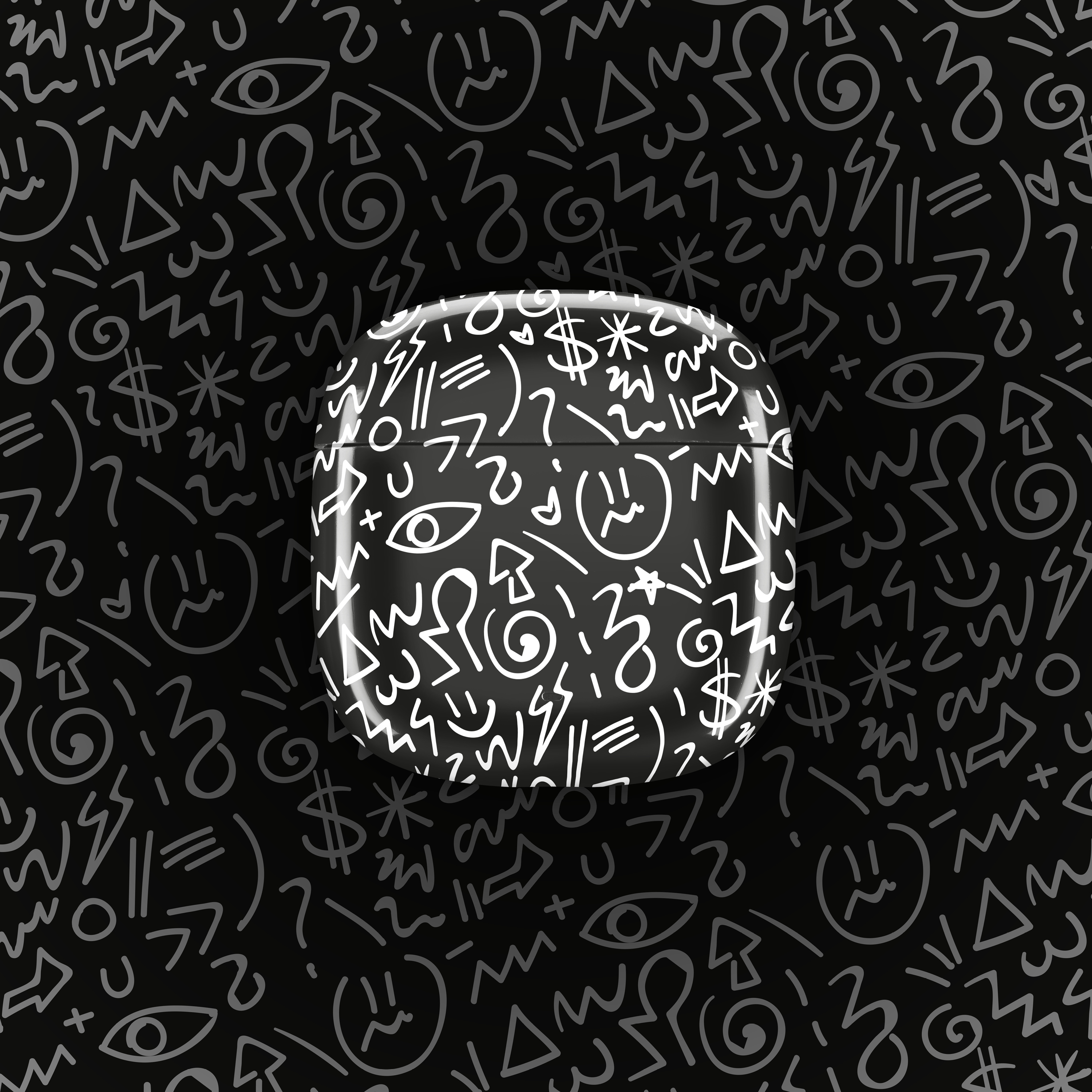 Eine schwarze Kopfhörerhülle mit weißen Symbolen auf schwarzem Hintergrund mit ähnlichen Symbolen.