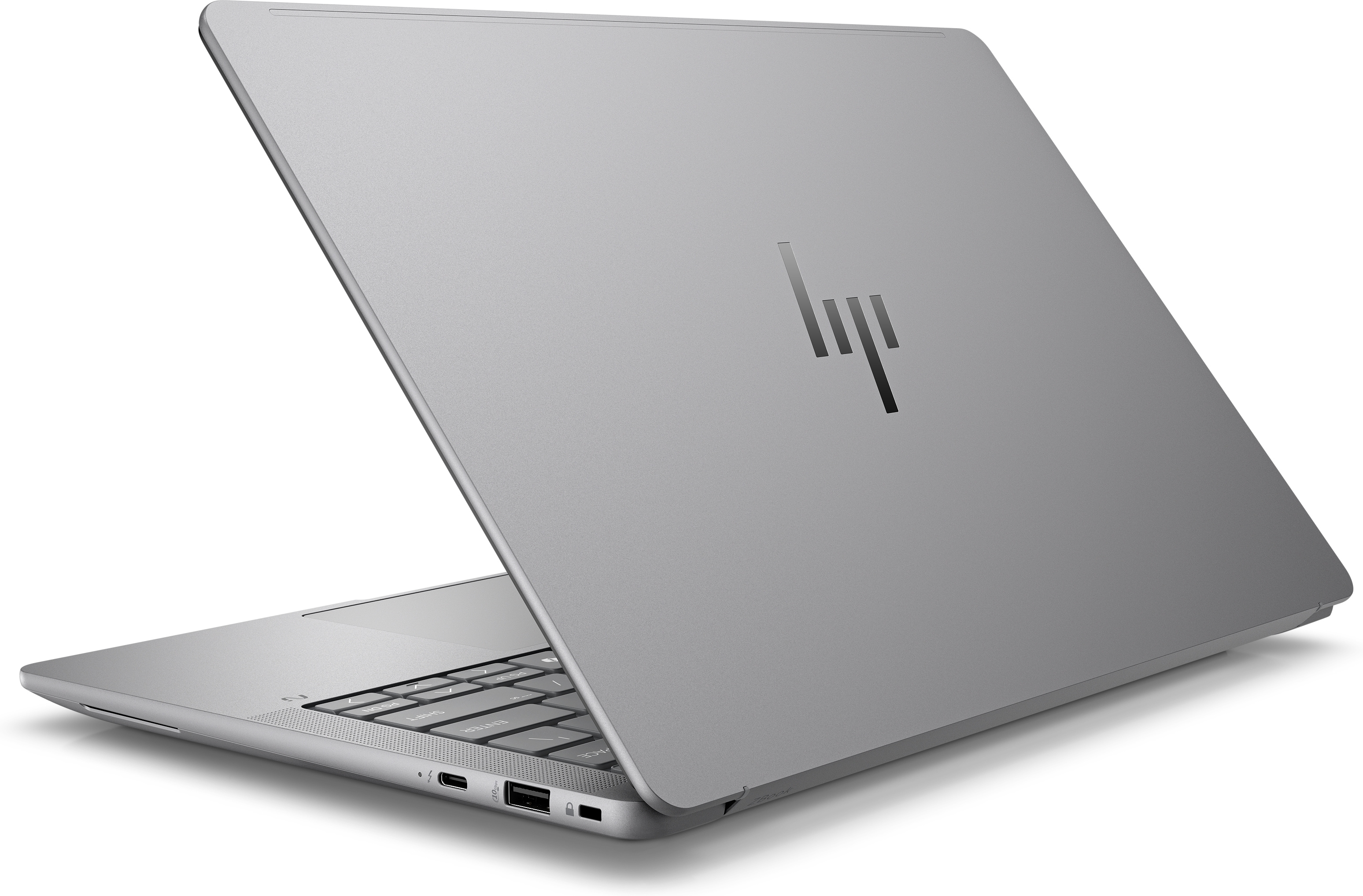 Laptop argentato, chiuso, vista angolata. Logo HP visibile sulla cover.