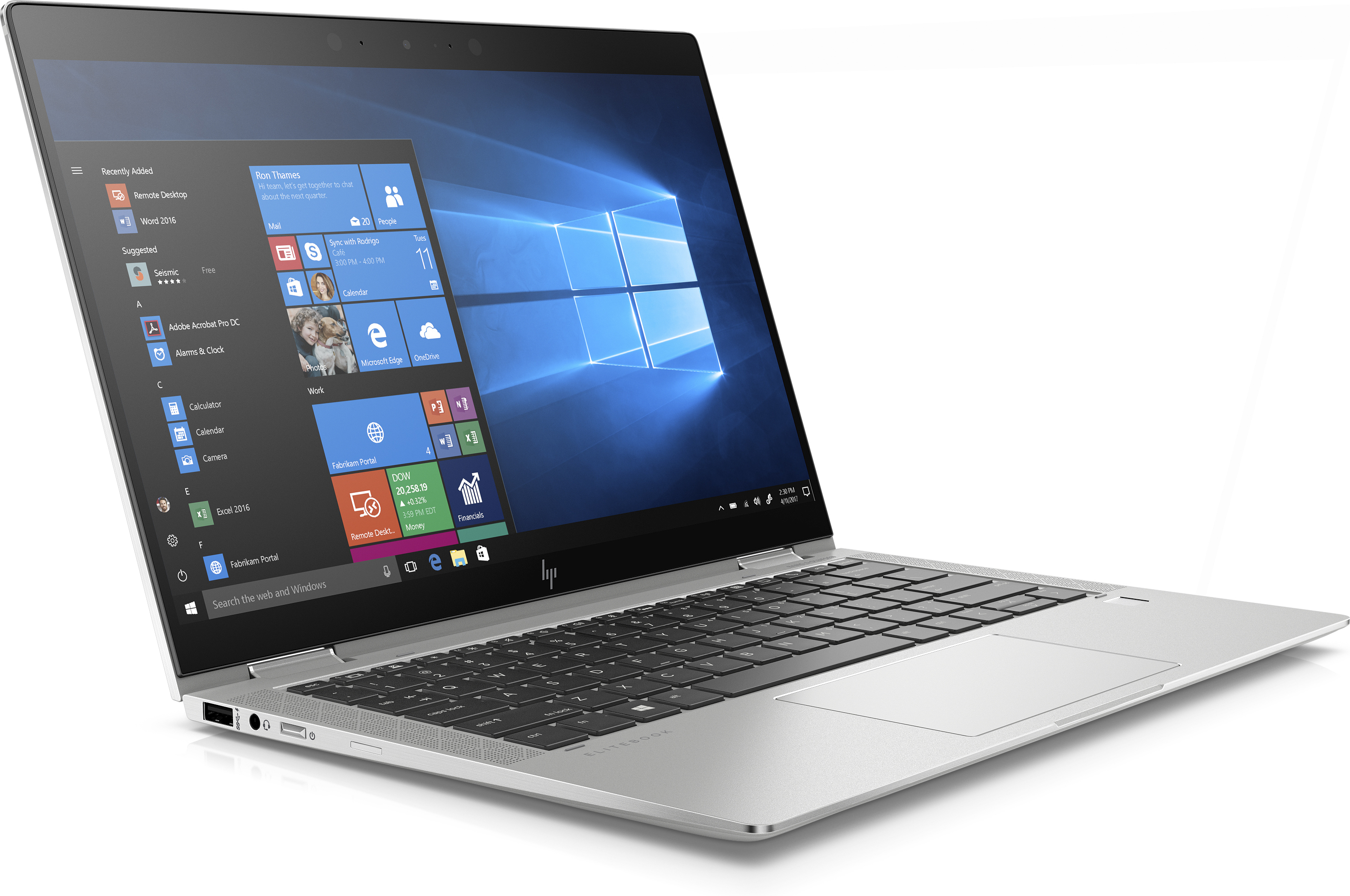 Silver laptop with black keyboard, open, showing the Windows desktop.