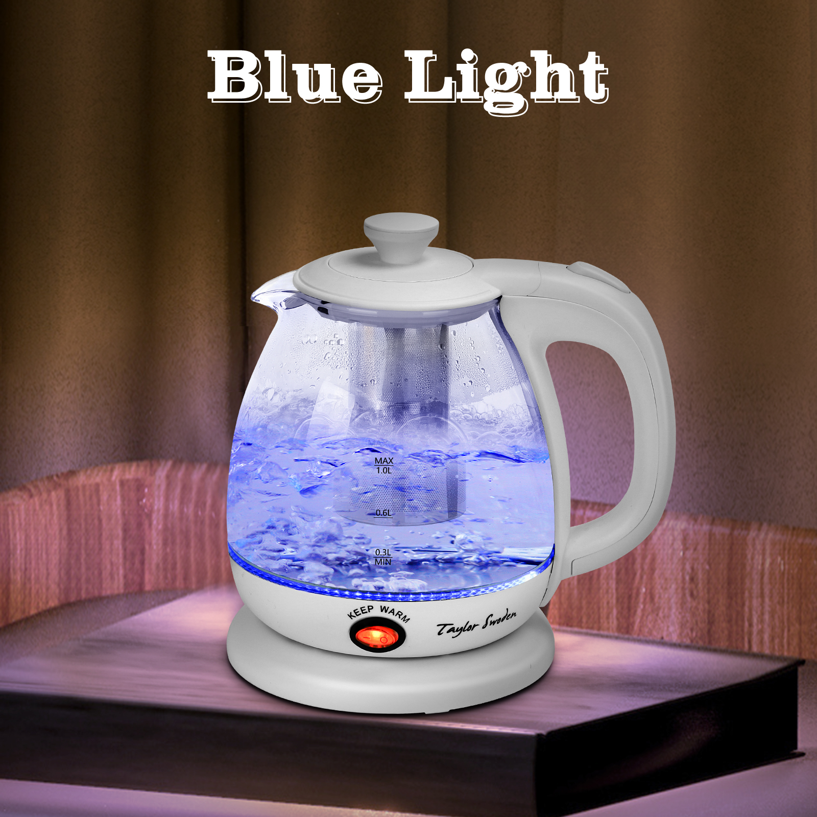 Una tetera eléctrica de vidrio con luz azul, sobre una mesa.