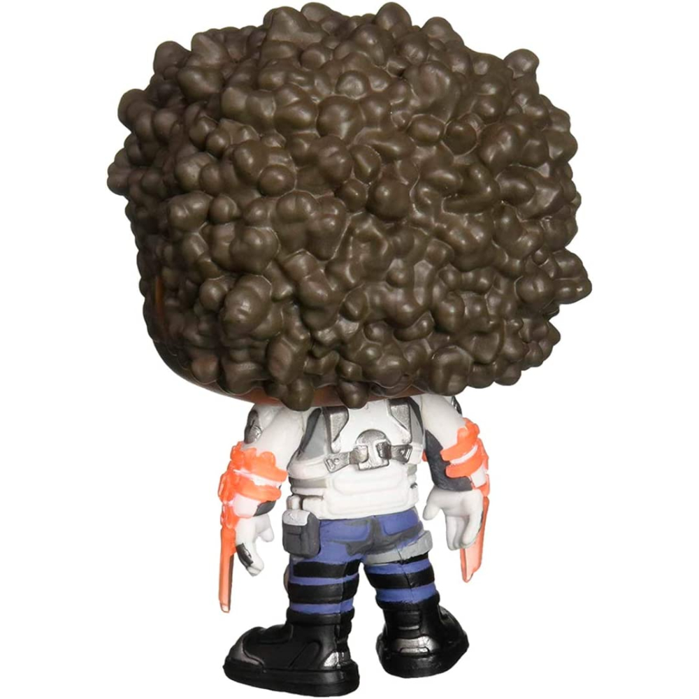 Una figura Funko Pop di un personaggio con grandi capelli castani e un vestito bianco e arancione.