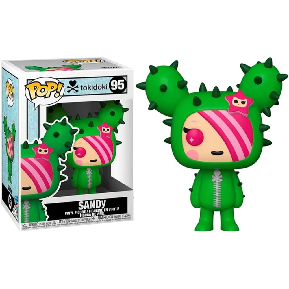 Sandy Pop Figur mit Box. Sie ist in einem grünen Kaktuskostüm mit rosa Haaren gekleidet.