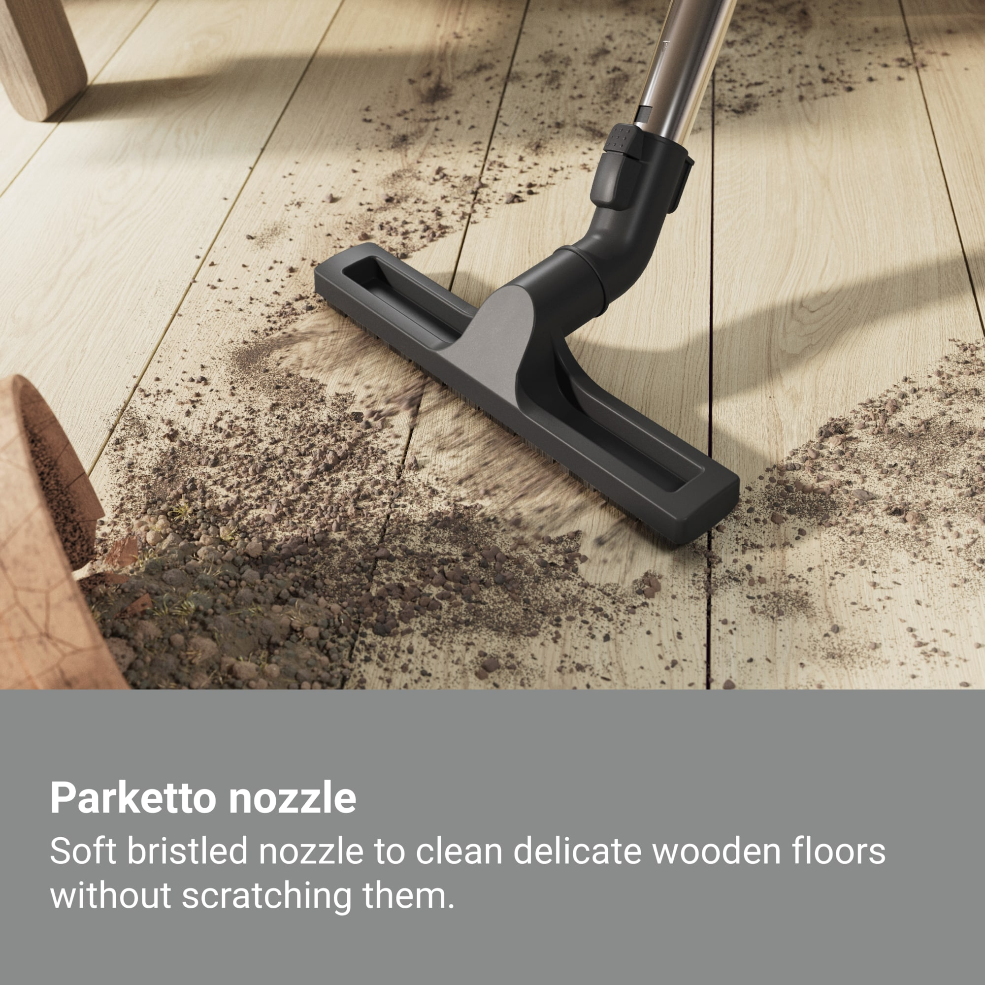Dysza odkurzacza na drewnianej podłodze czyszcząca brud. Tekst wyjaśnia użycie.