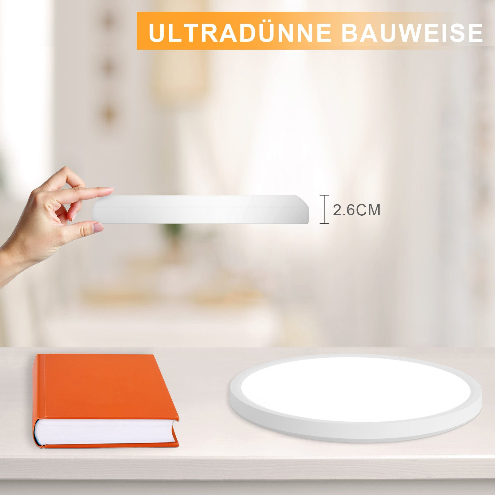 Hand hält dünnes, weißes LED-Panel mit orangefarbenem Buch und Licht.