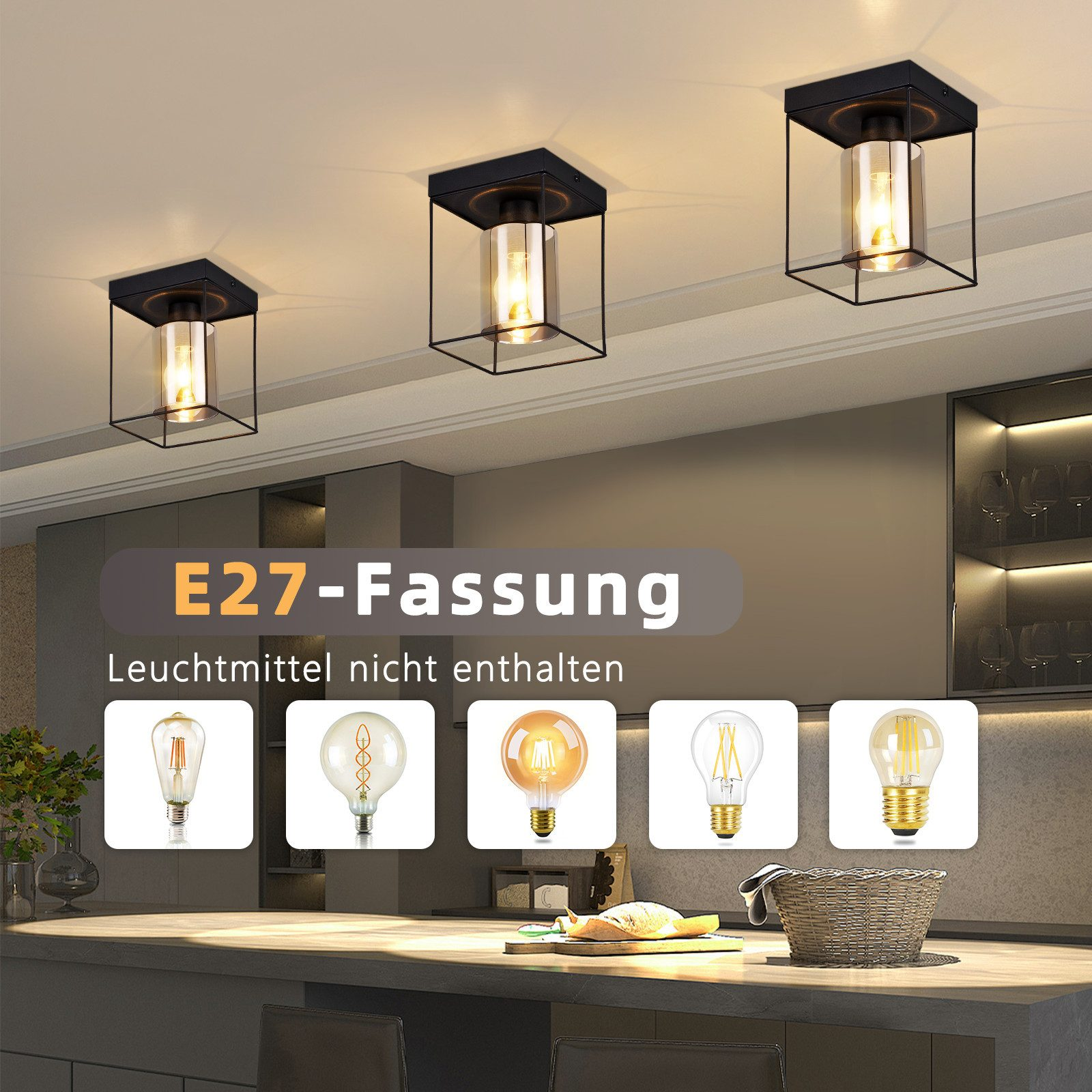 Tre plafoniere nere con un cilindro di vetro. Esempi di lampadine sono visualizzati sotto le luci.