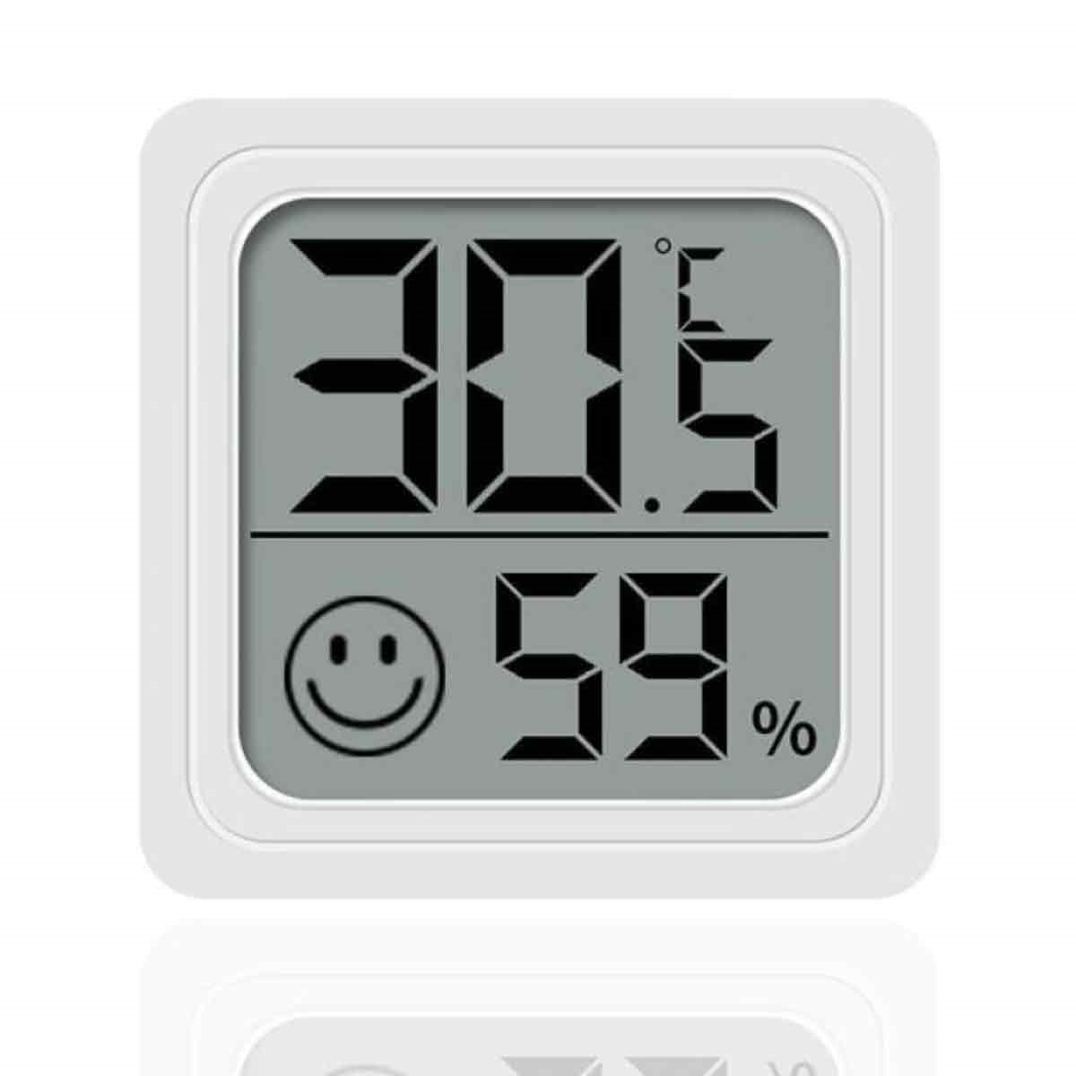 Weißes digitales Thermometer zeigt 30,5°C und 59%. Darunter wird ein Smiley angezeigt.