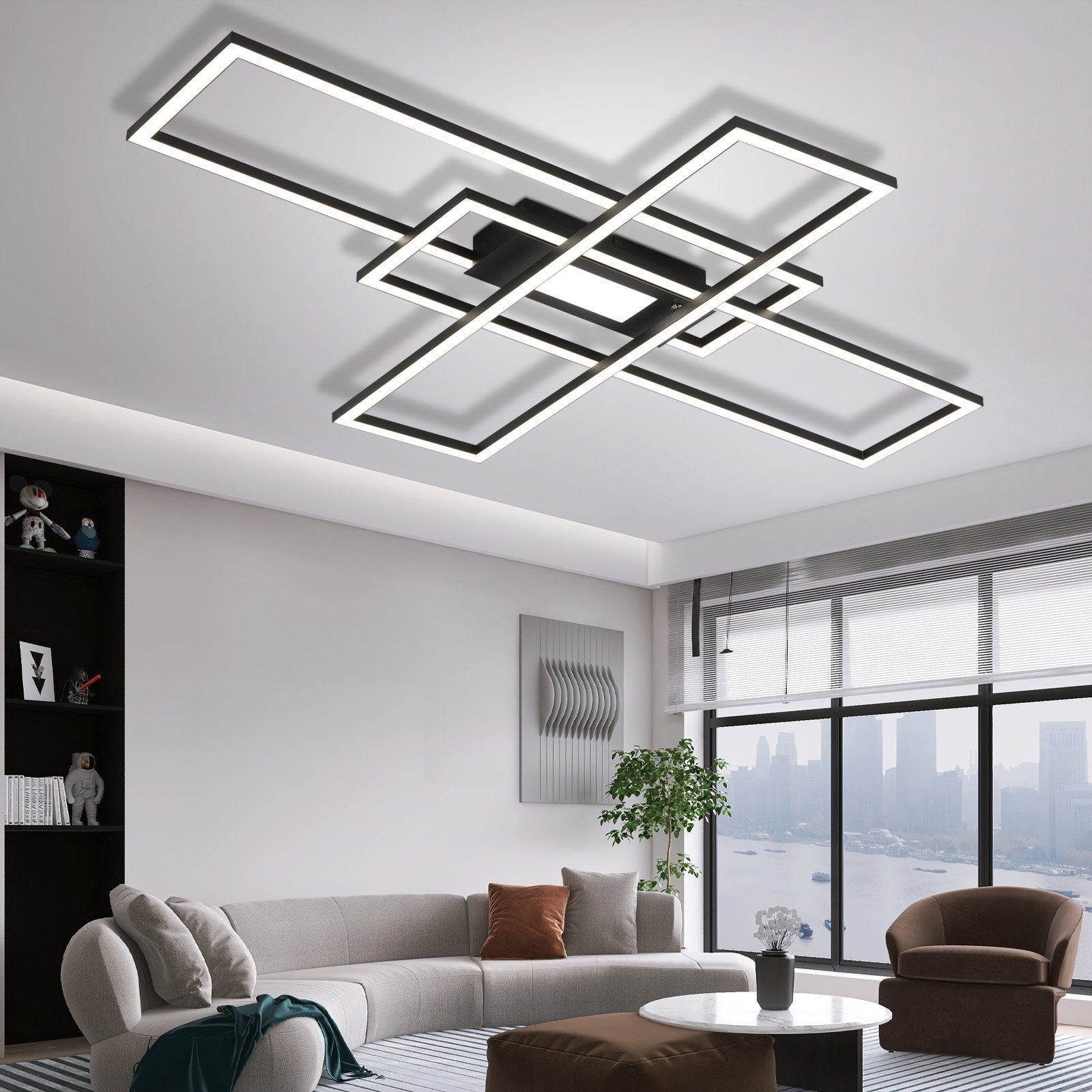 Una sala de estar moderna con una lámpara de techo geométrica grande.