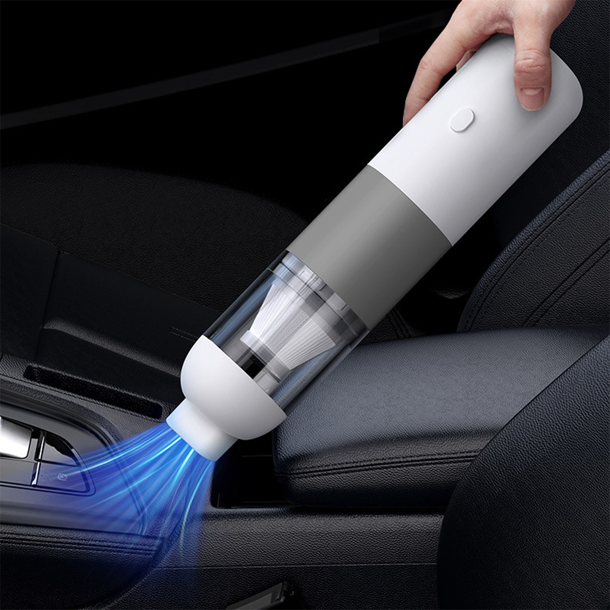 Ein tragbarer Staubsauger in einem Autoinnenraum, mit einem blauen Luftstromeffekt.