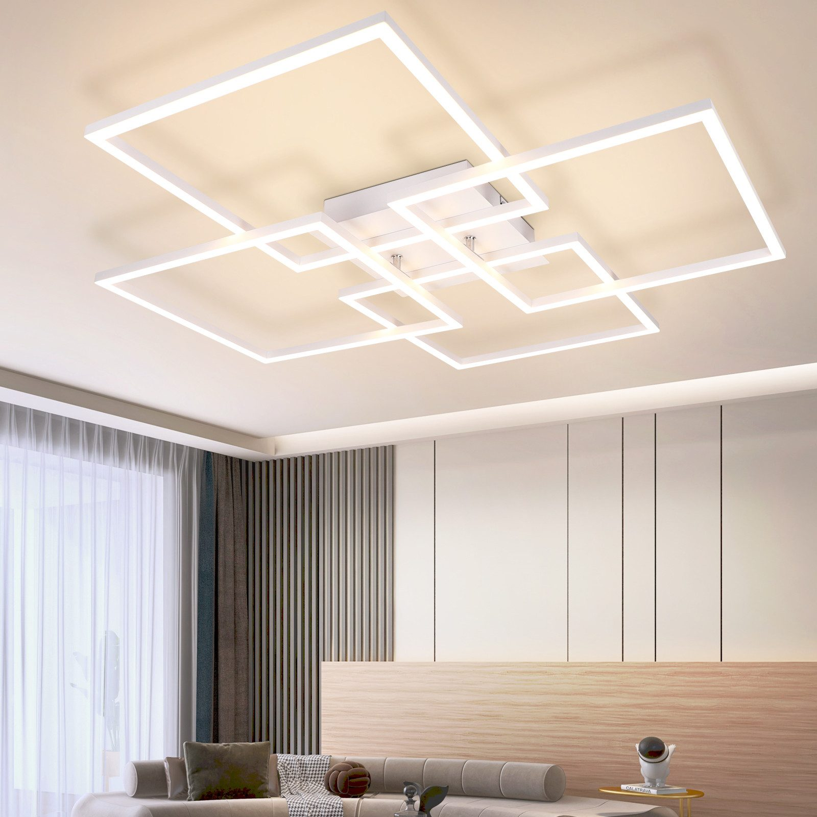 Biała, geometryczna lampa sufitowa. Ma wiele prostokątnych kształtów.