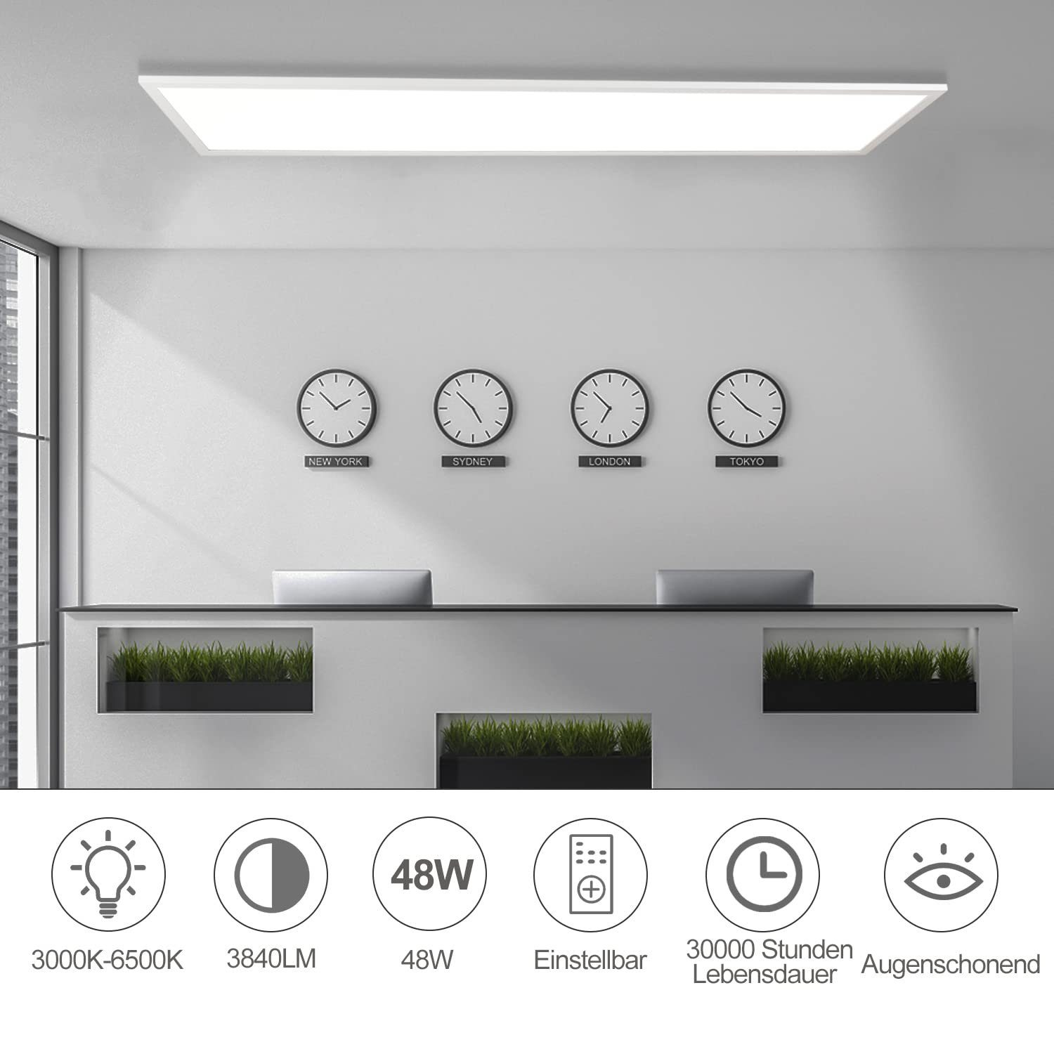 Interno di un ufficio con una lunga lampada da soffitto rettangolare sopra un bancone della reception. Gli orologi mostrano i fusi orari.
