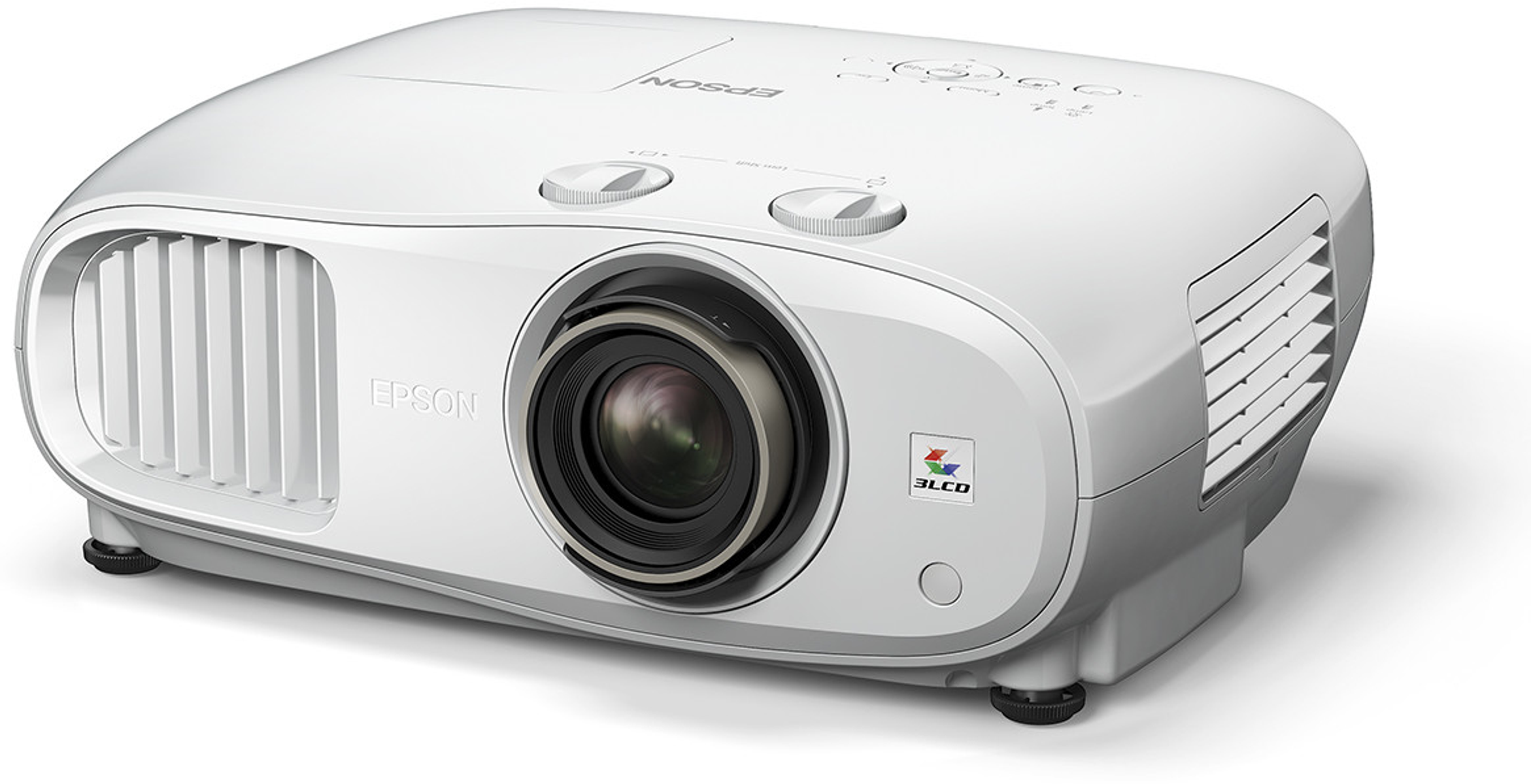 Proyector blanco con lente, botones y ventilaciones, sobre una superficie blanca.