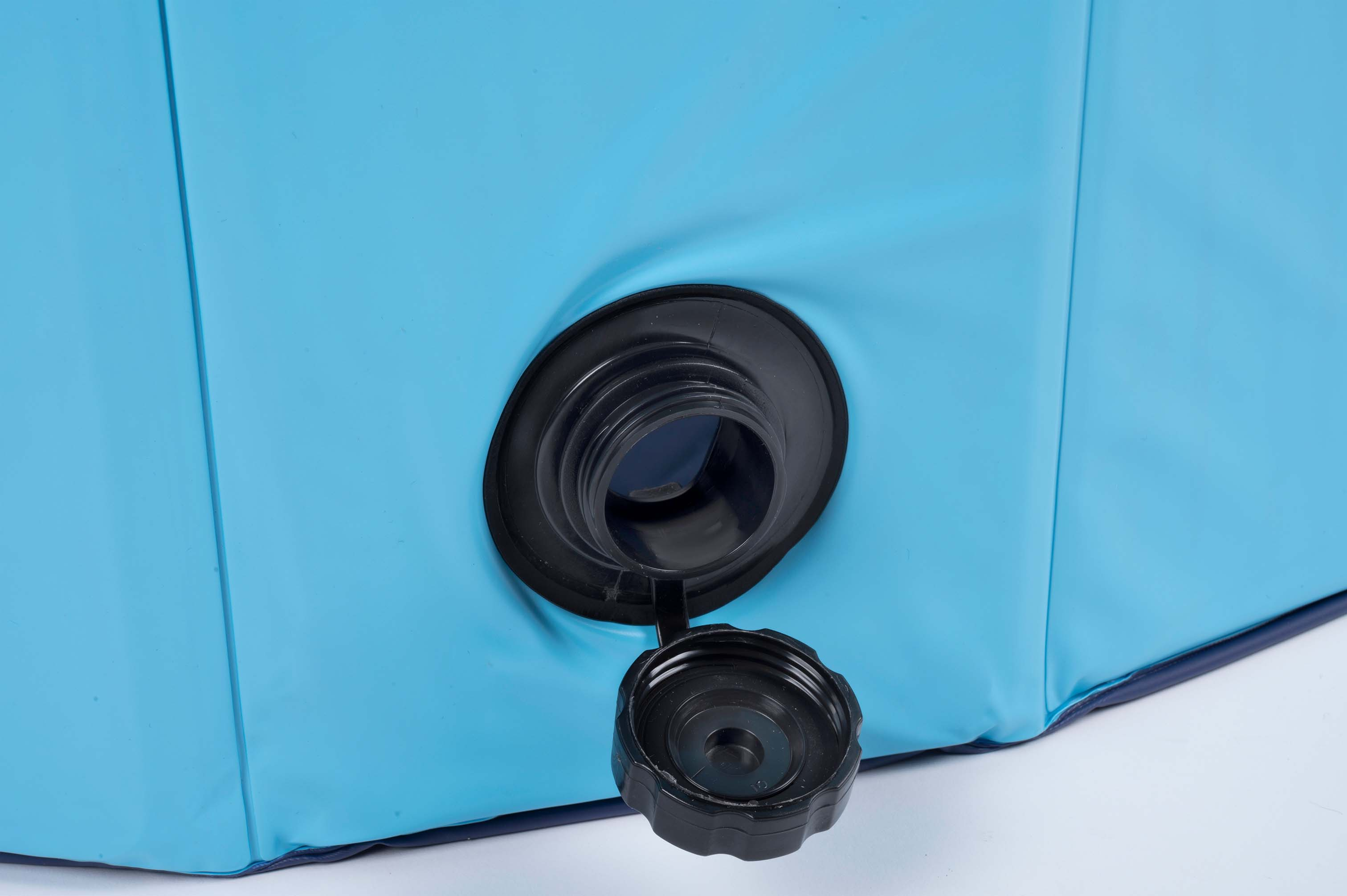 A blue inflatable pool with a black drain valve and open cap.