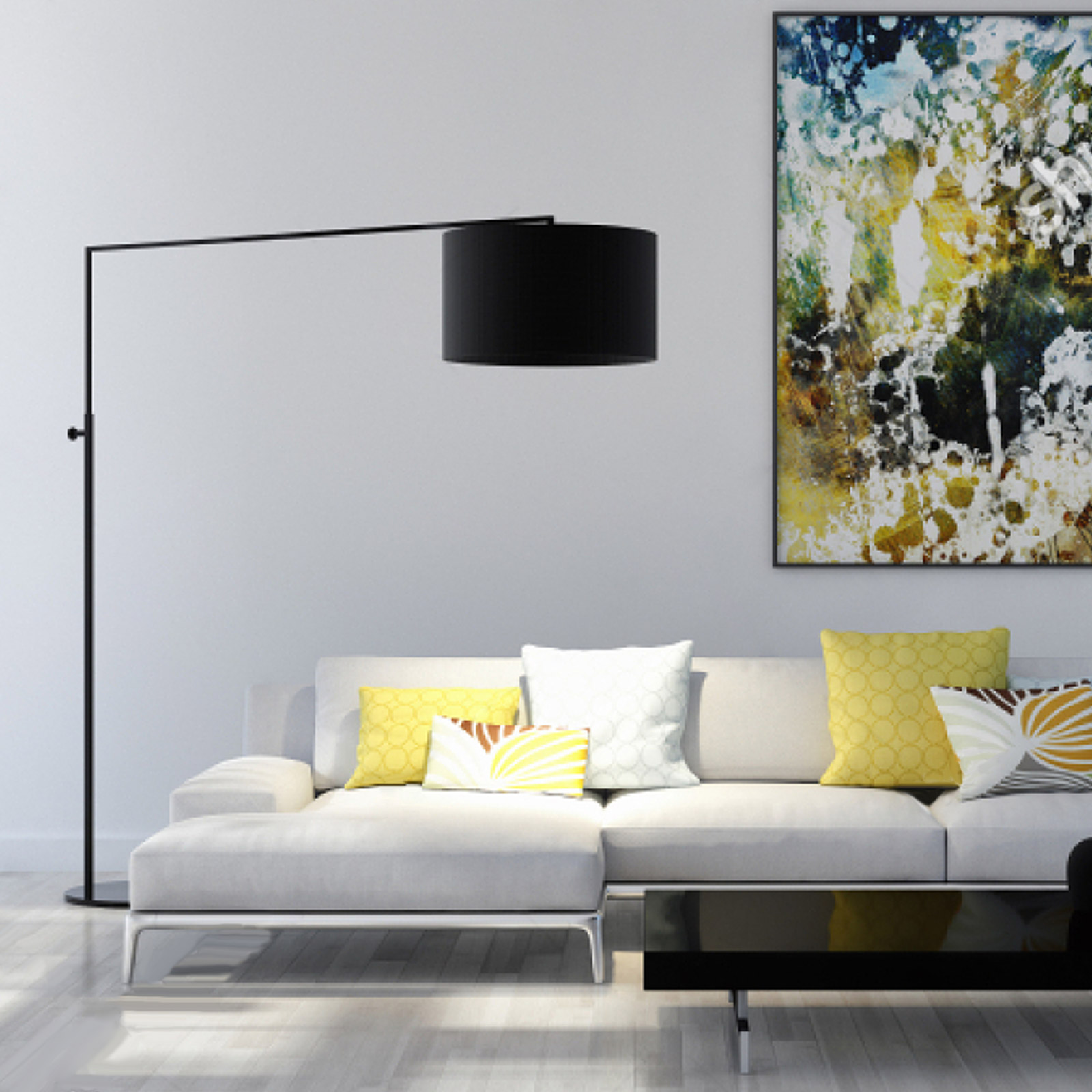 Soggiorno con divano bianco, lampada nera e arte. Cuscini gialli e bianchi sul divano.