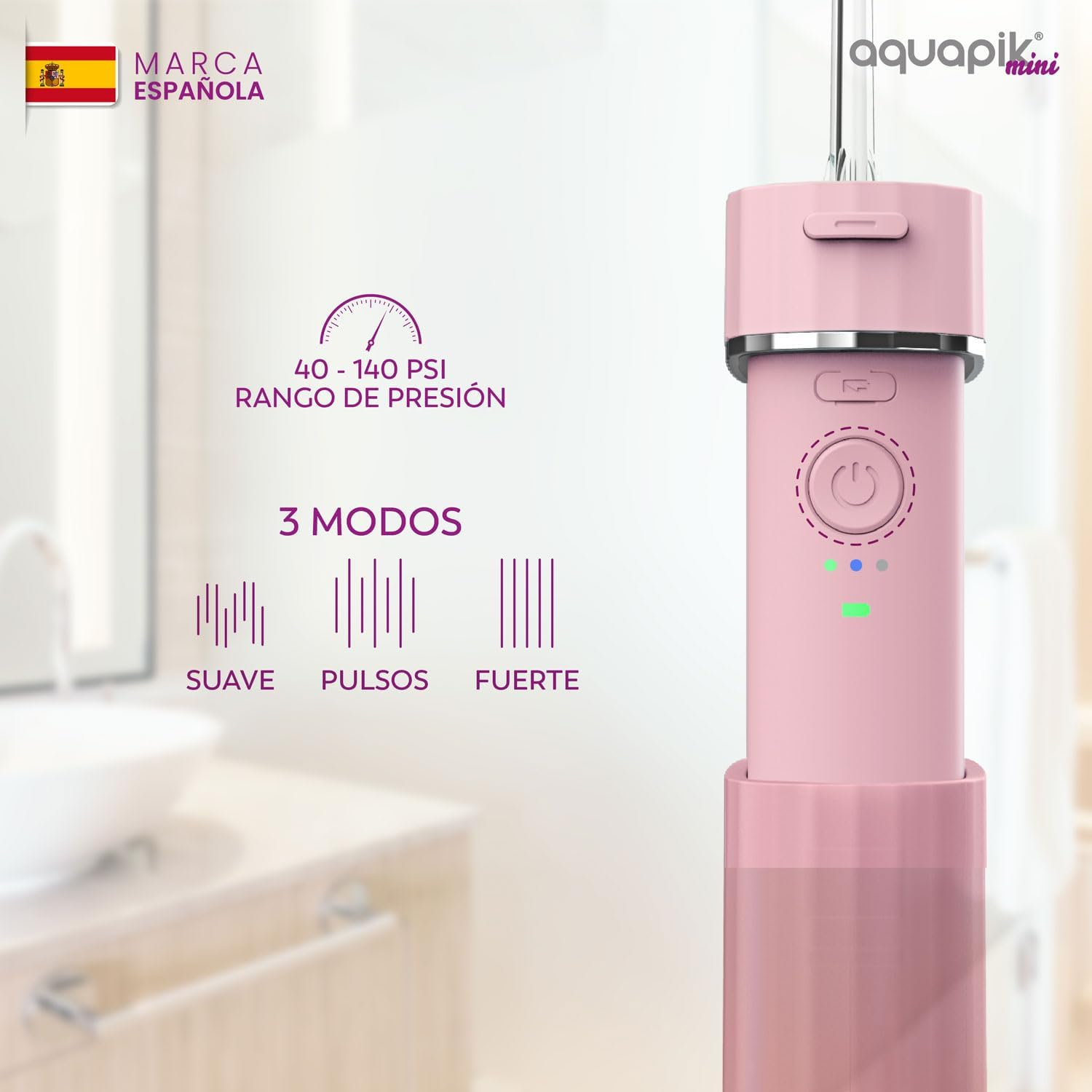 Un irrigador oral rosa con un depósito de agua y botones de control. Muestra los ajustes de presión.