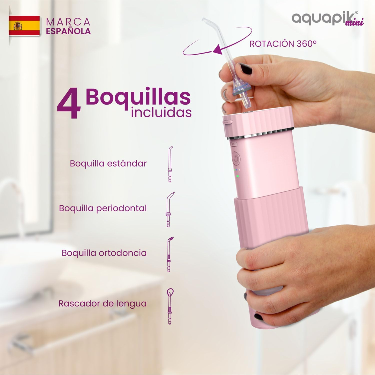 Dispositivo Aquapik Mini rosa con accesorios. La mano de una mujer sostiene el dispositivo cerca de las boquillas.