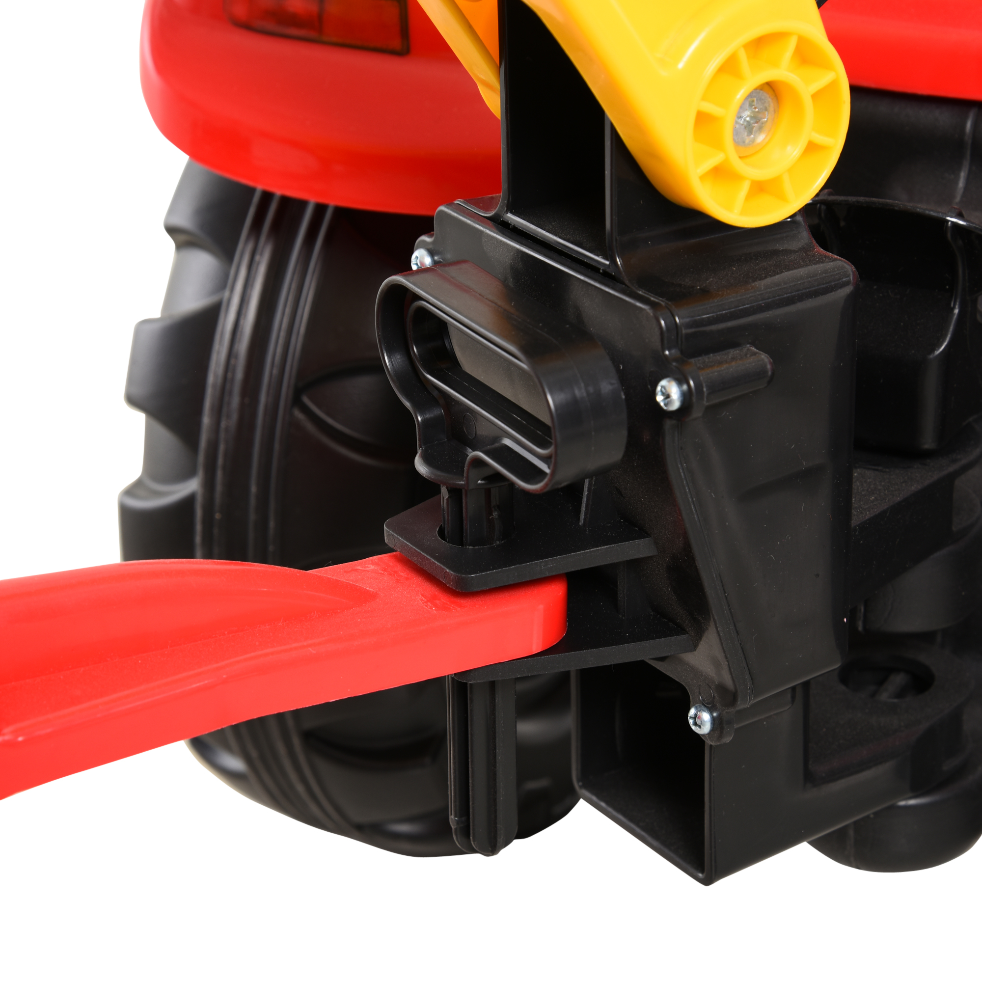 Primo piano della plastica nera e del braccio della scavatrice gialla di un trattore giocattolo rosso.