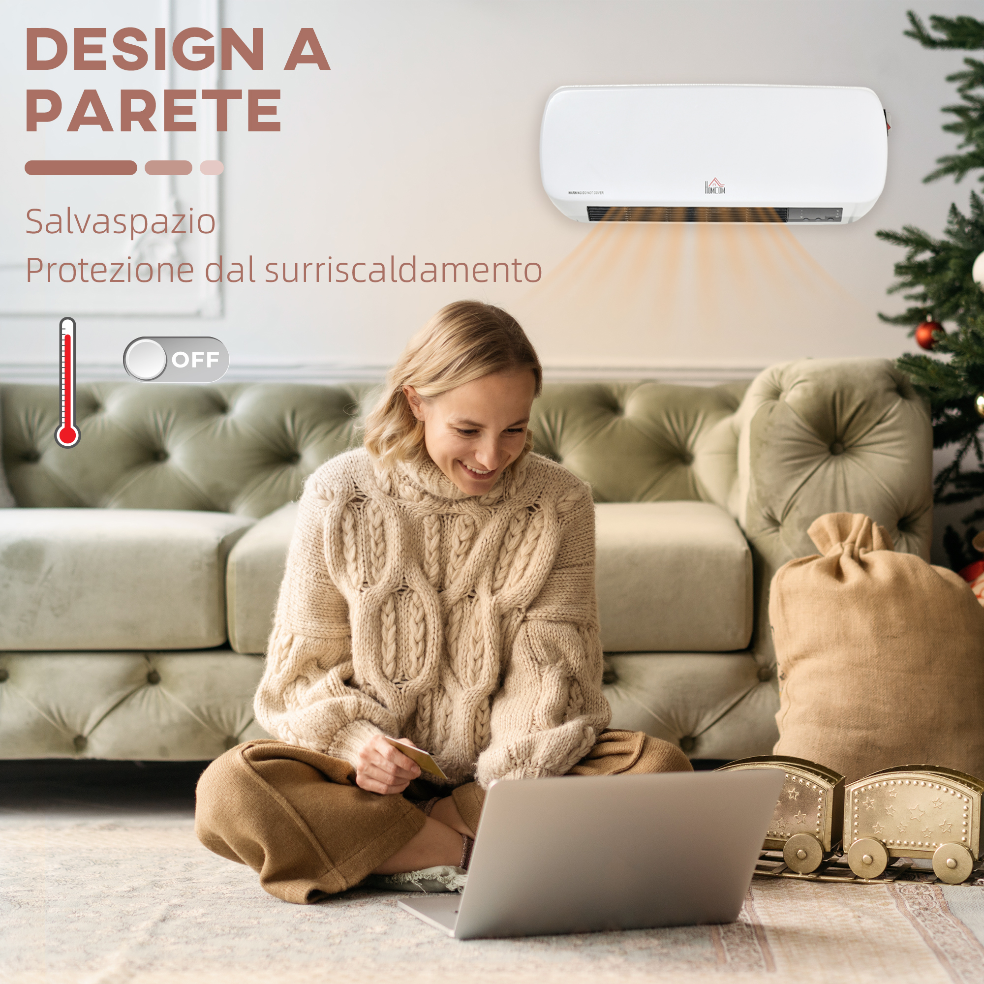 Donna usa laptop, seduta a terra. Termosifone a parete sopra, albero di Natale e regali sullo sfondo.