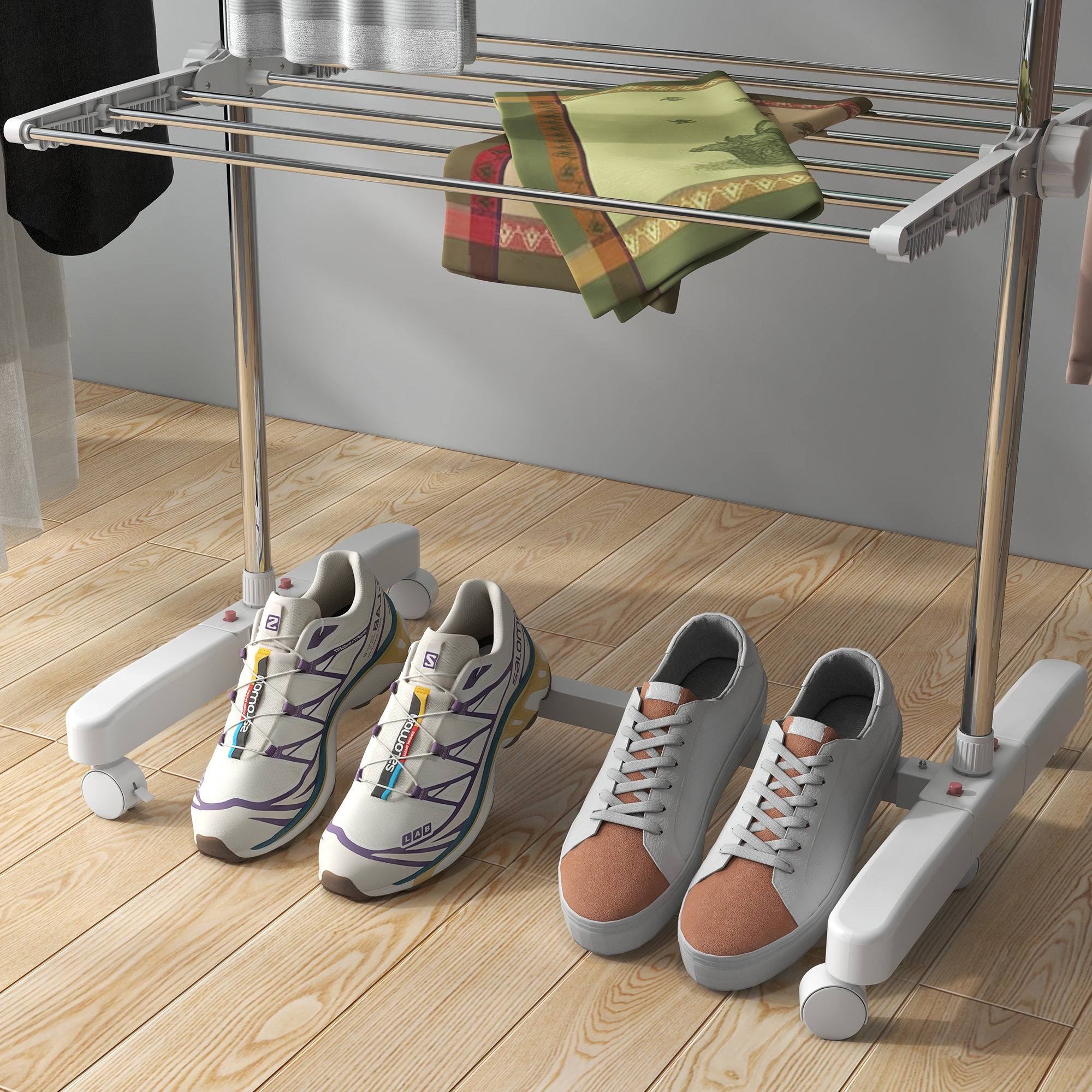 Uno stendibiancheria con scarpe sotto e vestiti appesi sopra. Una sciarpa è drappeggiata sullo stendino.